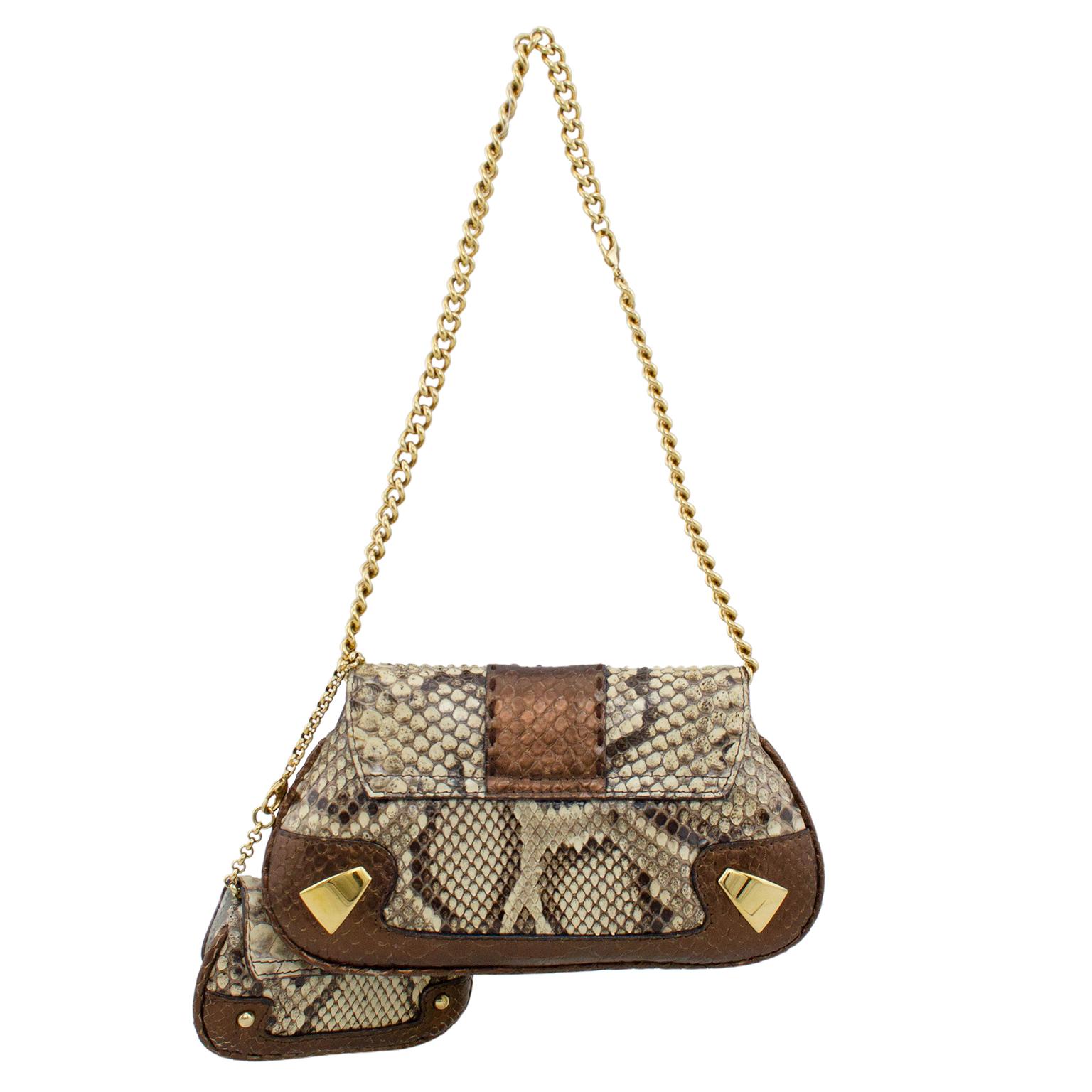 1990s Dolce and Gabbana bronze and cream small bag. Flap front with gold tone metal oval shaped handle to open and close. Flap fastens with two strong magnetic buttons. Matching gold tone details on front and back corners and chain strap. Small