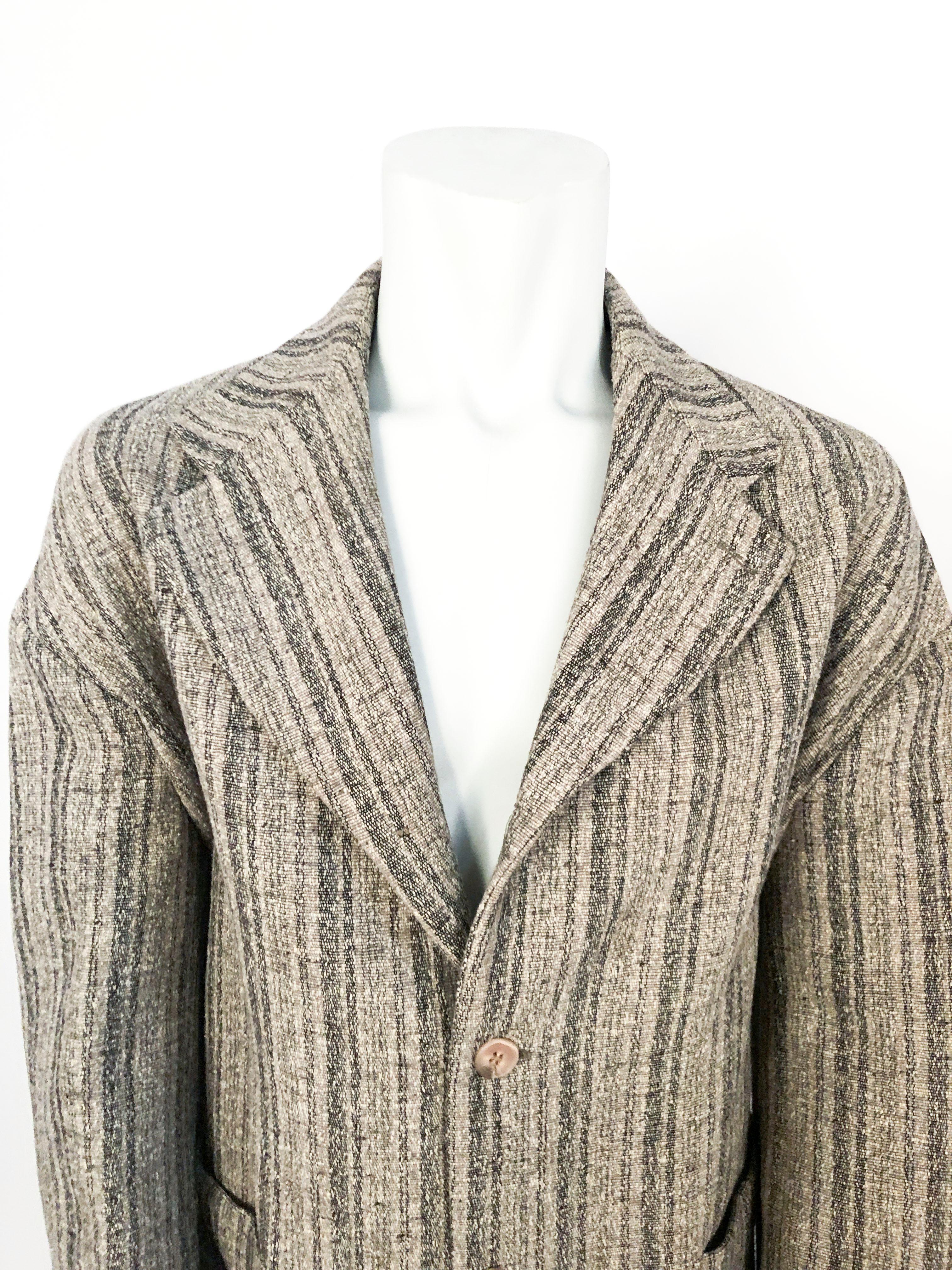1990s Dolce and Gabbana grey tweed jacket with vertical striped pattern, large patch bucket pockets, and brown suede elbow patches. This piece is meant to be worn oversized. 