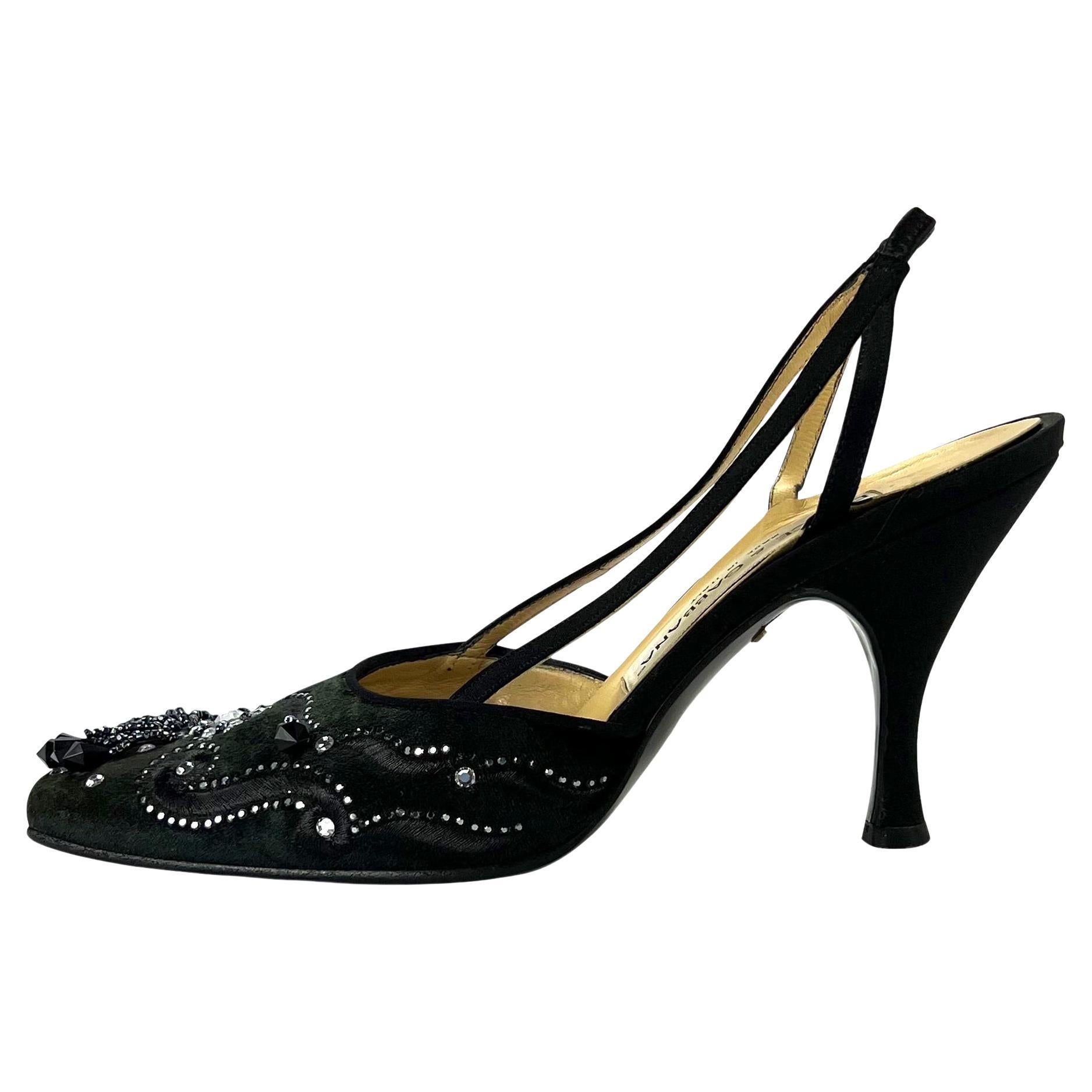 Presenting a fabulous pair of black velvet Dolce and Gabbana heels. Since the 1990s, these slingback heels have been made complete with a beaded and embroidered toe box. 

Additional Measurements: 
Heel height: 3.25