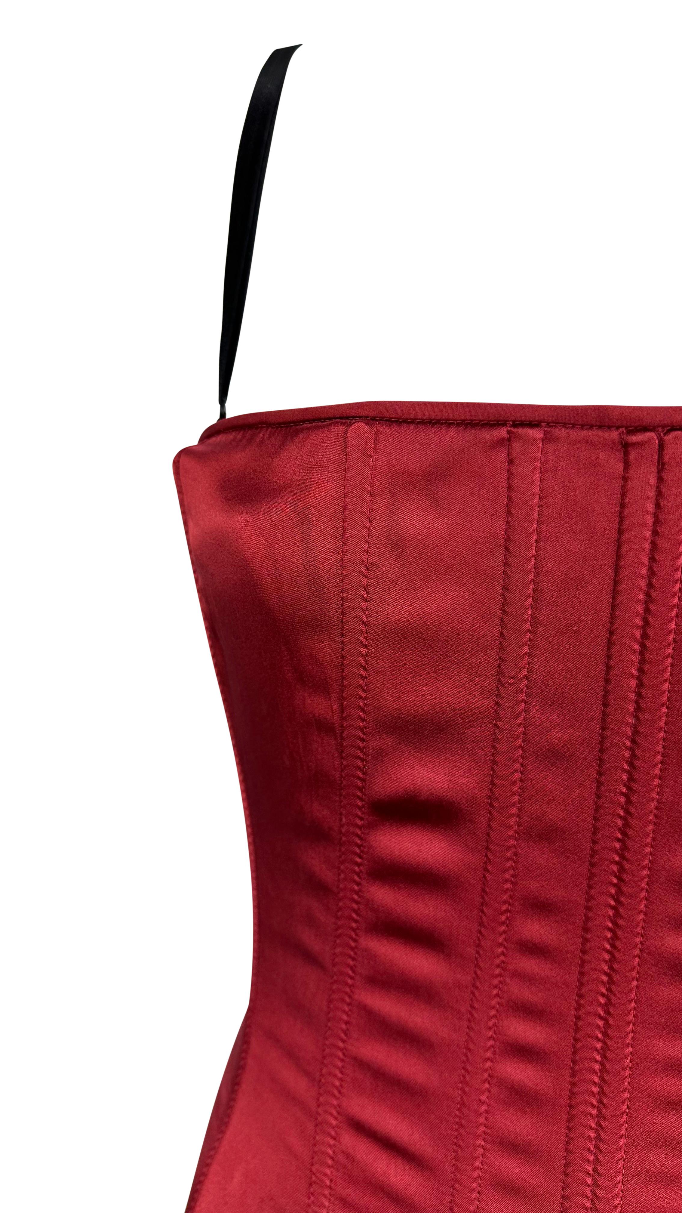Presenting a fabulous red silk satin Dolce and Gabbana corset. From the late 1990s/early 2000s this top is crafted with meticulous attention to detail, this deep red masterpiece envelops you in the luxurious embrace of silk satin. With boning for