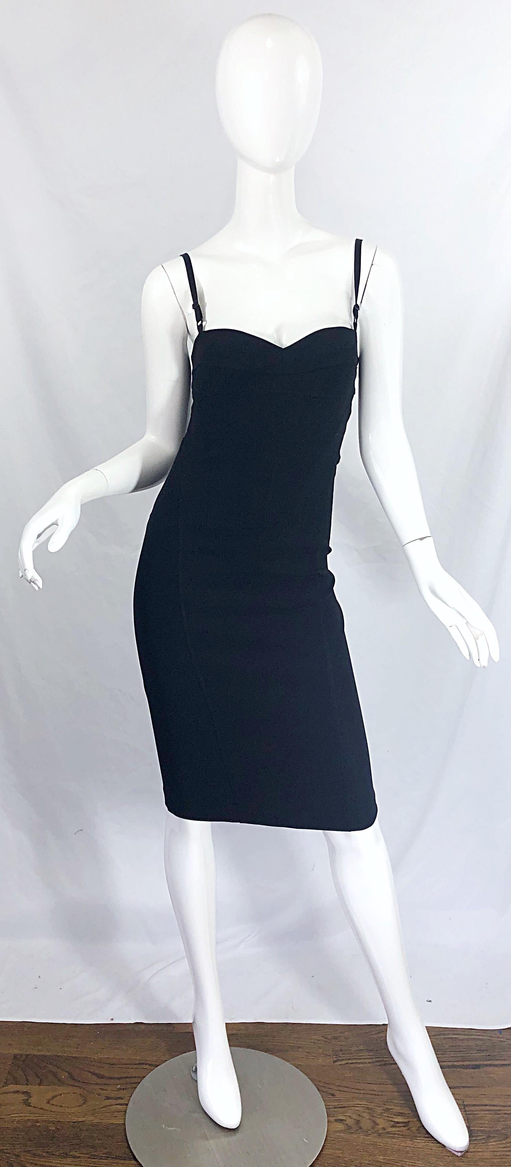 Sexy and iconic late 90s DOLCE & GABBAN black bodycon corset dress ! A classic little black dress that is a timeless addition to any wardrobe. Corset style bodice with adjustable straps. Hidden zipper up the back with hook-and-eye closure. Very
