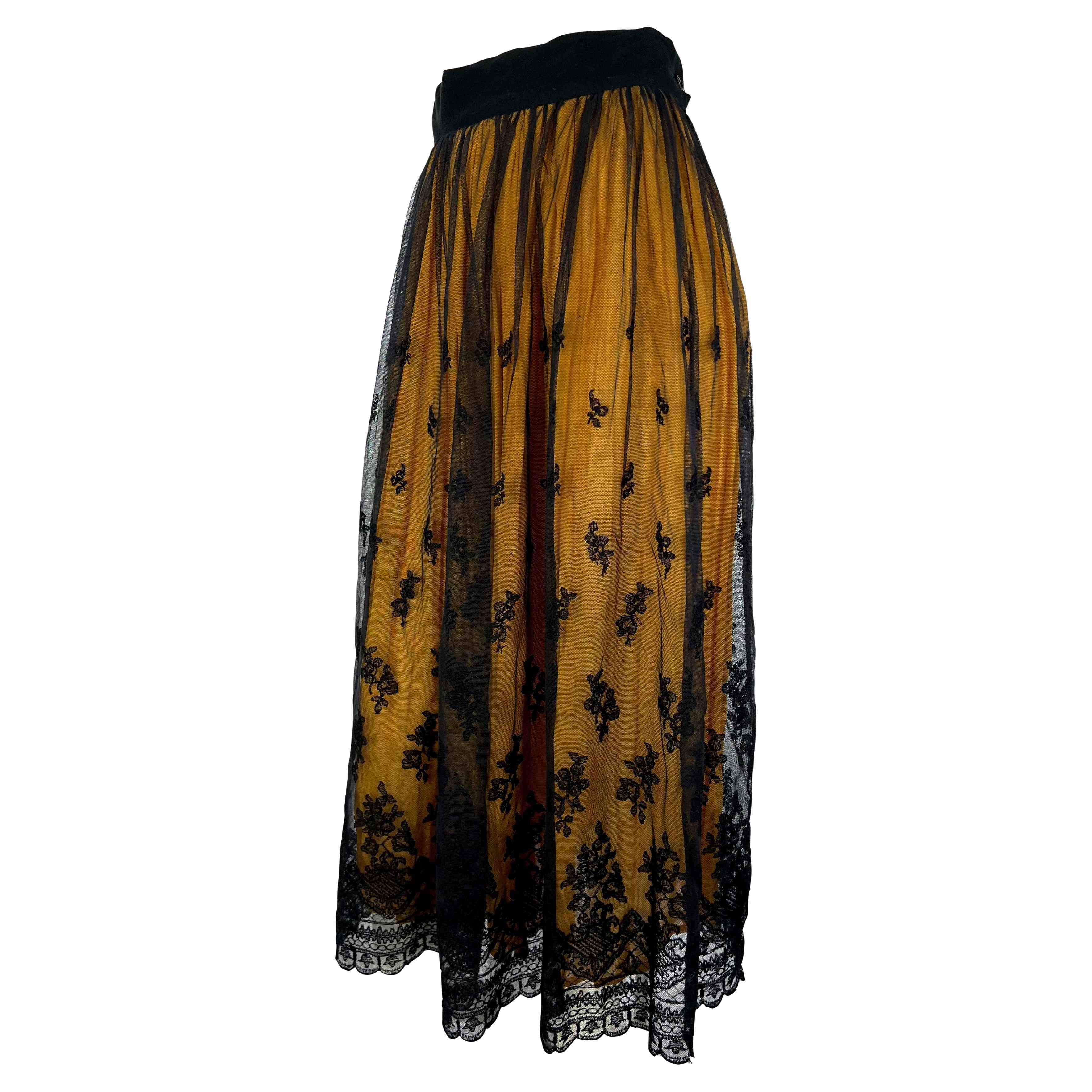 Presenting a black lace and yellow chiffon maxi skirt designed by Dolce & Gabbana in the early 1990s. This piece represents D&G's ability to combine classic Sicilian design elements with pin-up sex appeal. Check out our storefront for more vintage