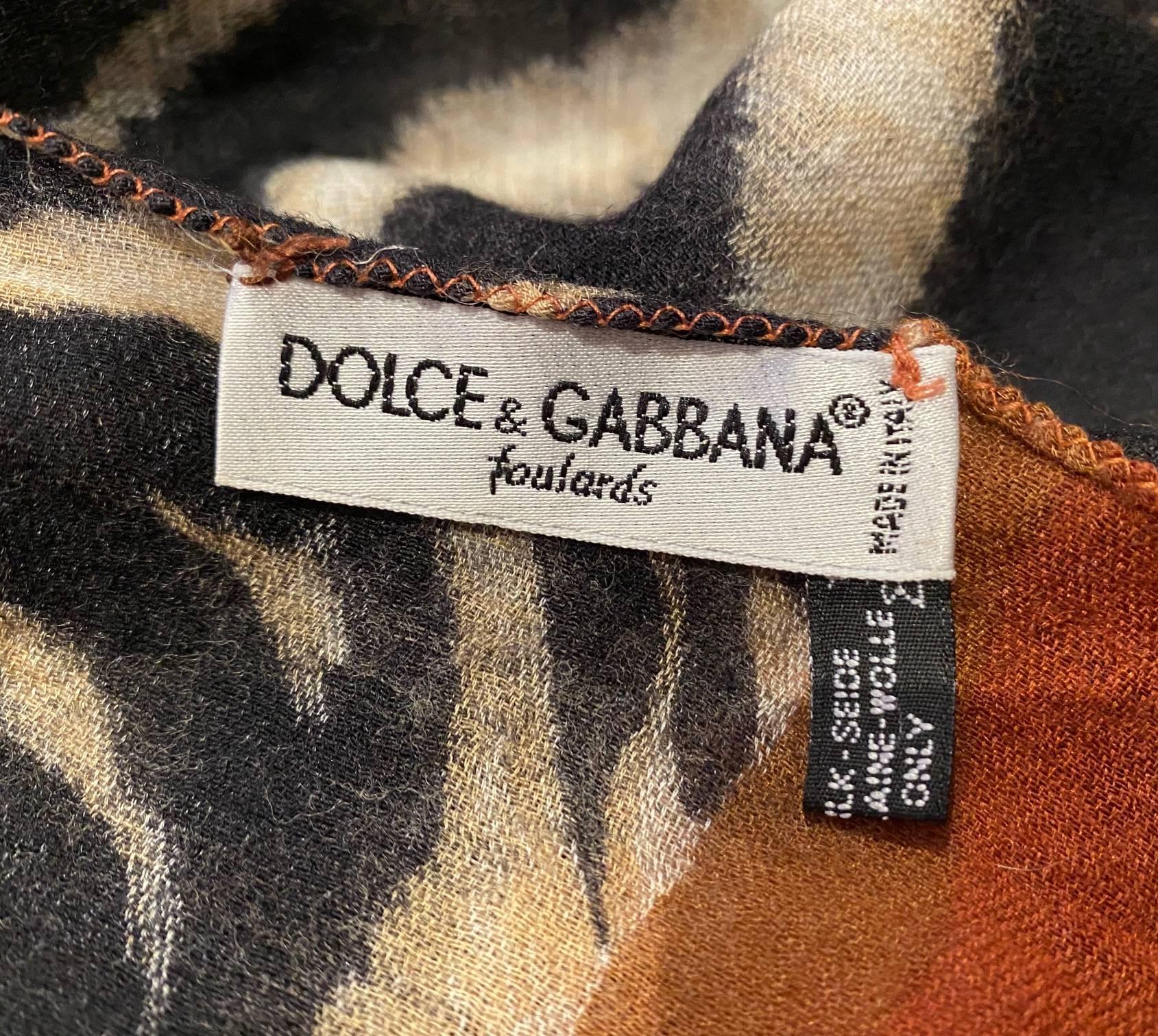 1990's Dolce Gabbana vintage zebra skin print shawl scarf pareo, 50% silk, 50% wool, Made in Italy  This luxurious blend of silk and wool is sure to keep you comfortable and warm, with the iconic zebra print adding the perfect touch of