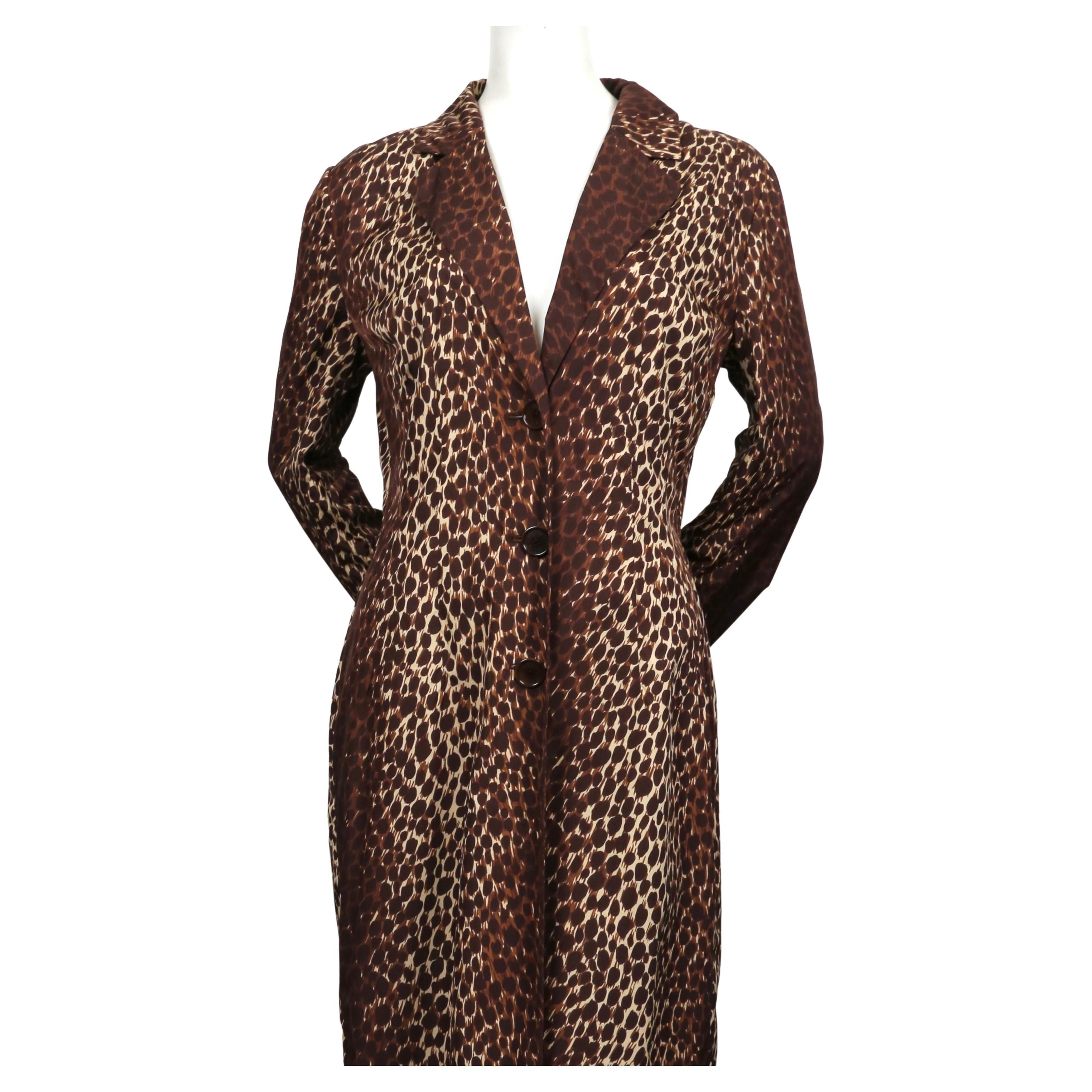Long leopard print coat from Dolce and Gabbana dating to the 1990's. Labeled an Italian 44. Approximate measurements: shoulder 17