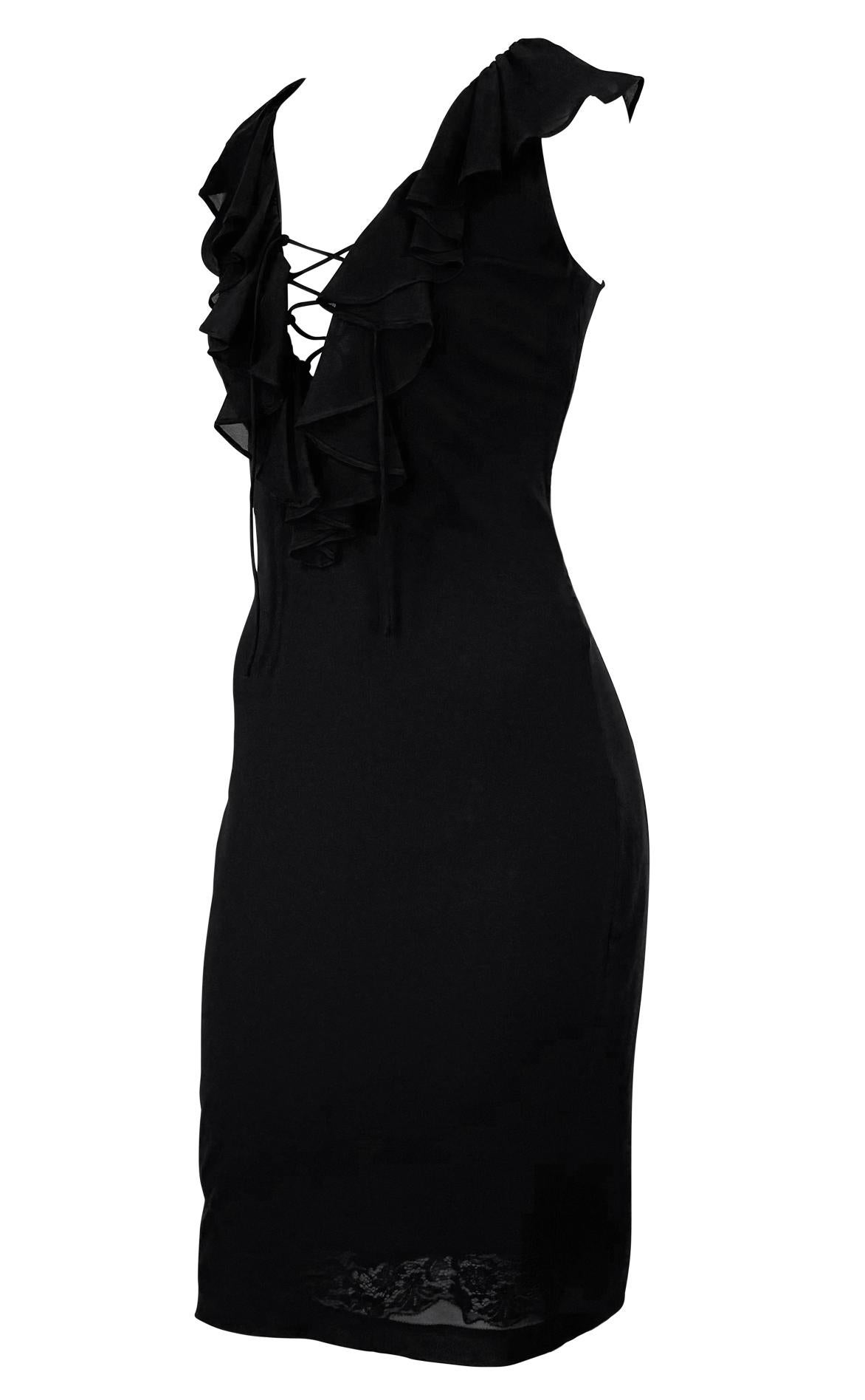 Designed by Dolce & Gabbana in the late 1990s, this black bodycon cocktail dress features a plunging lace-up neckline framed by cascading ruffles. A sutble lace hem at the interior lining peeks through the semi-sheer silk-stretch blend for a flirty