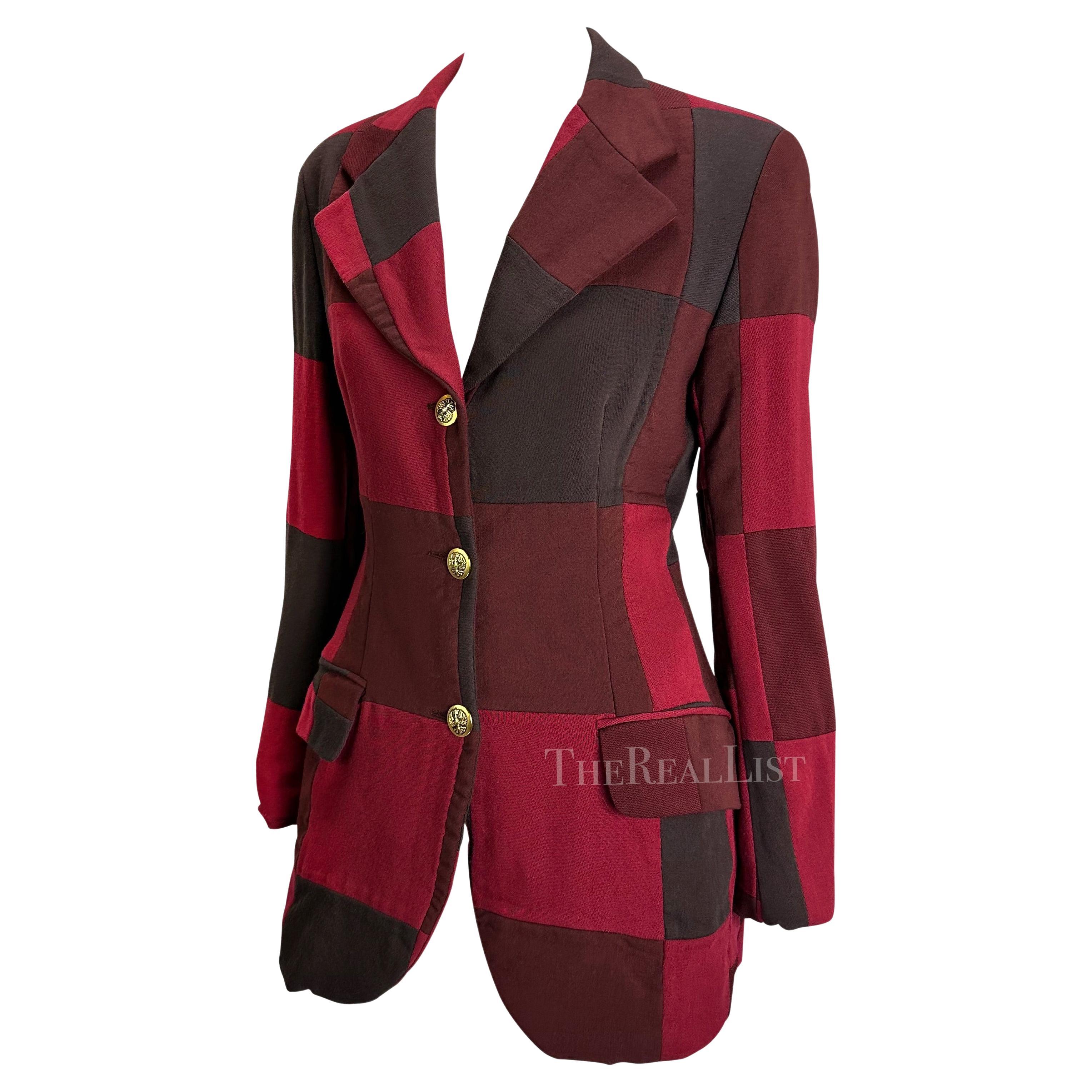 Presenting a fabulous red patchwork Dolce and Gabbana Blazer. From the early 1990s, this jacket is constructed of multiple monochromatic red hue patches and is made complete with a large gold-tone crest button closures at the front. Add this chic