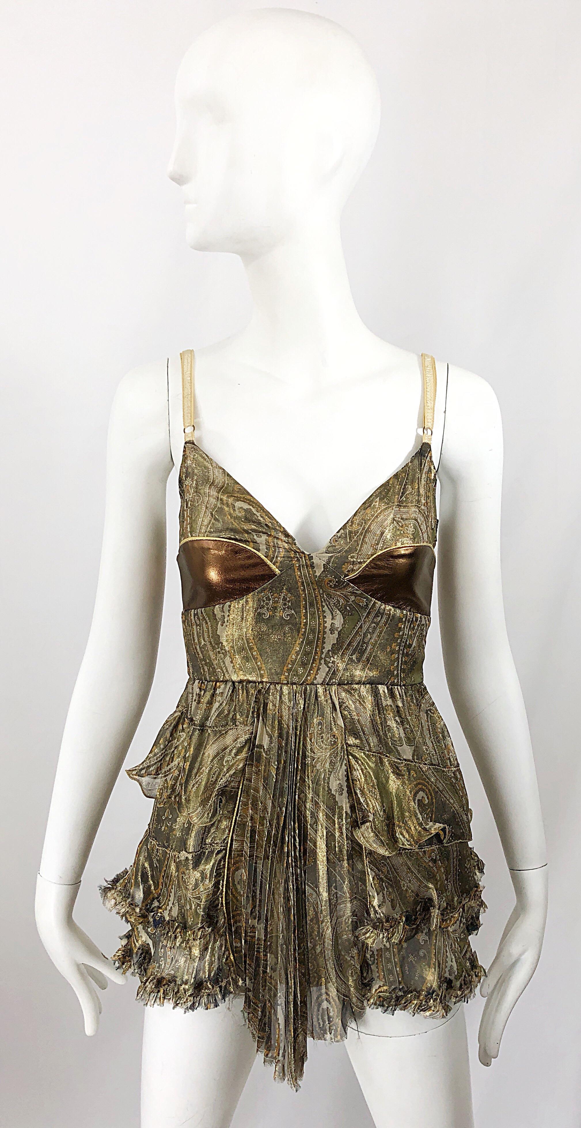 Sexy late 90s DOLCE & GABBANA silk and leather paisley metallic babydoll top! Features paisley prints in warm tones of greens and browns. Bronze leather metallic bronze panels at each breast. Ruffles and pleats throughout. Full metal zipper up the
