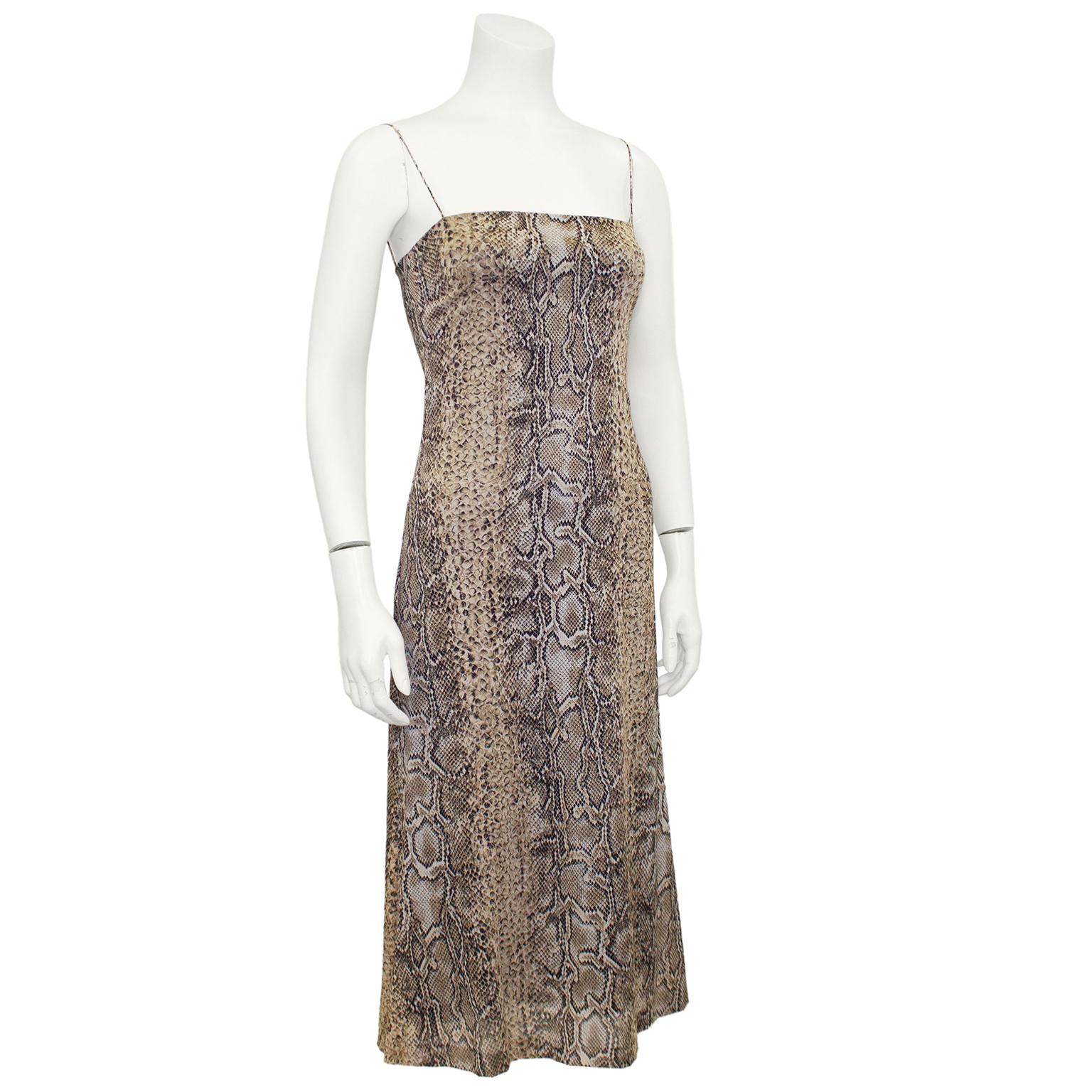 Simple and elegant Dolce & Gabbana slip cocktail dress from the 1990s. Silk chiffon all over snake print with a straight neckline and very small spaghetti straps. Invisible zipper up centre back. Lined with a black slip. Excellent vintage condition.