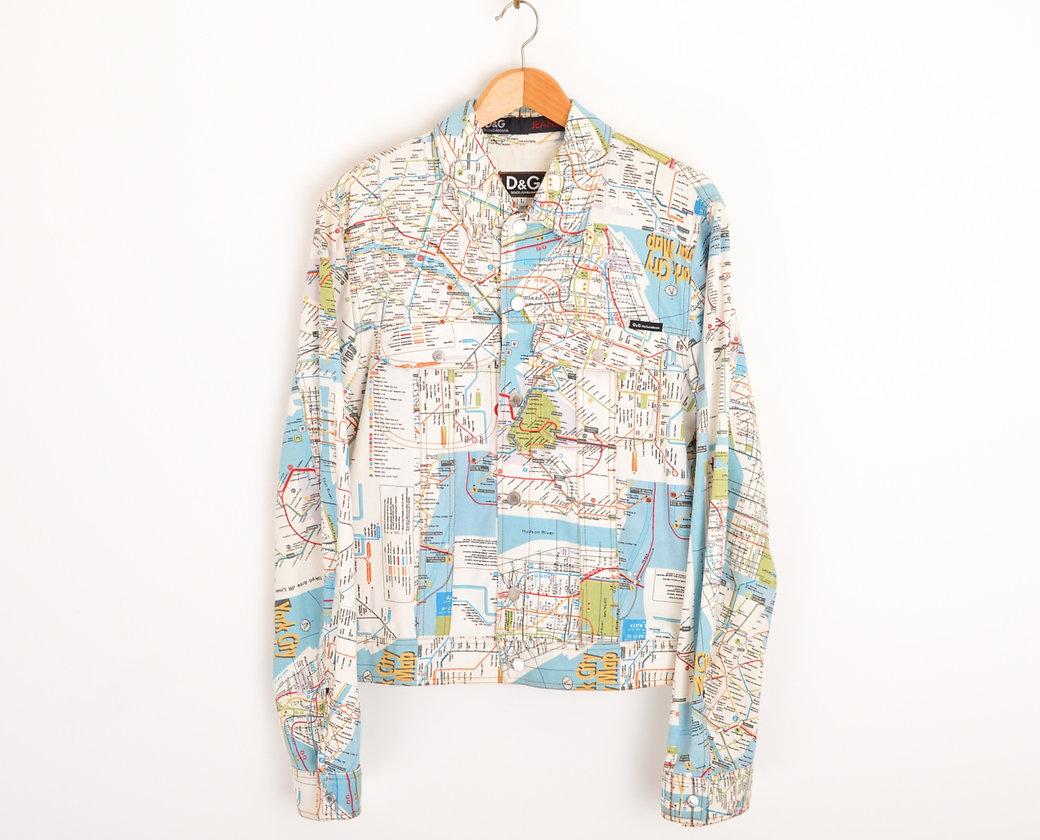 2000's Dolce & Gabbana denim jacket, depicting Underground Route Maps throughout of various cities, such as Paris, New York & London. 
 
Features;
Central line button fasten
Dolce & Gabanna embossed studs
Chest pockets
D&G breast tab
100% Cotton
