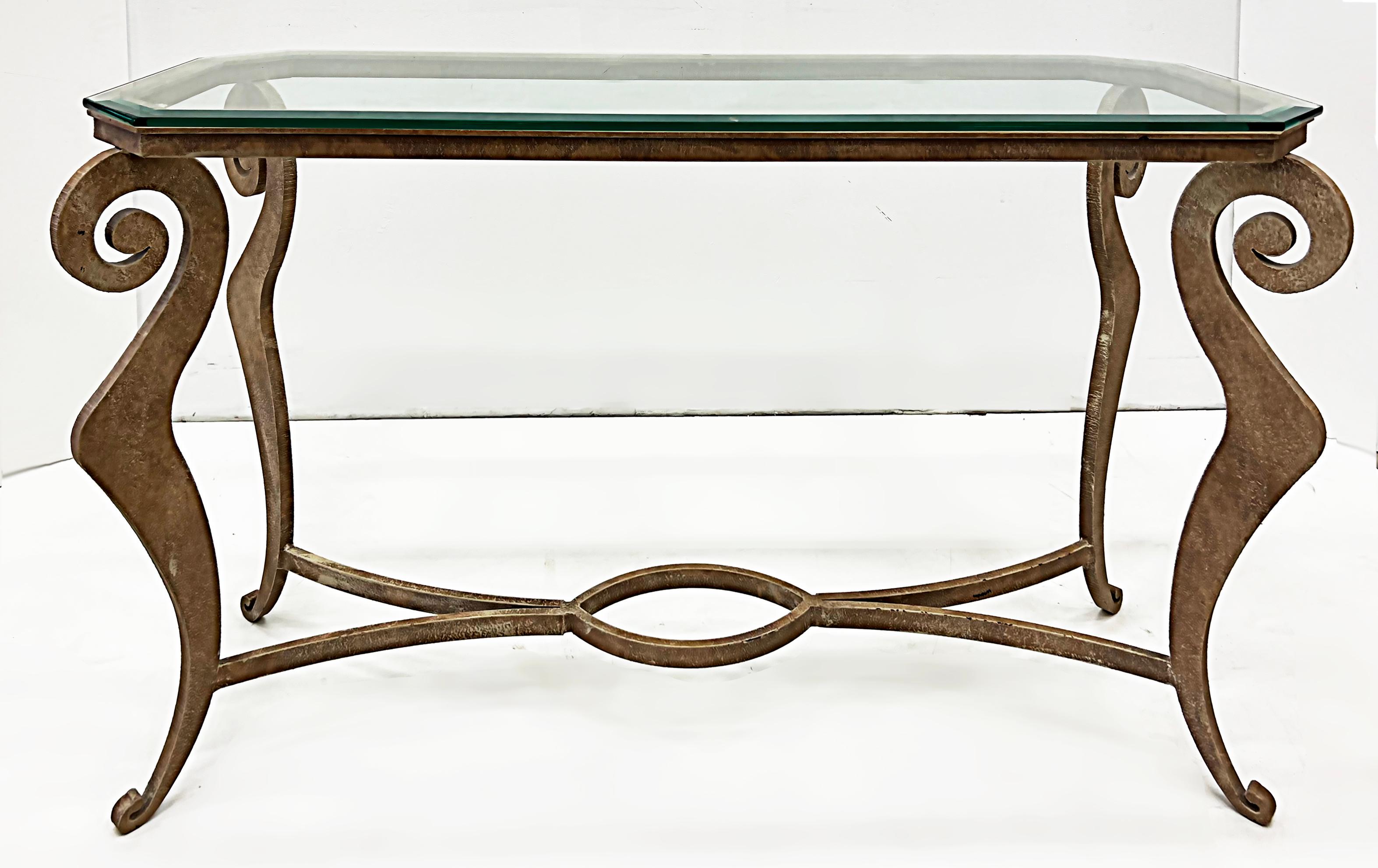 1990s Donghia Style Steel Cut Stylized Console Table with Glass Top

Offered for sale is a very substantial stylized vintage 1990s Donghia style cut steel console with a fitted beveled glass top. The frame is well made with very thick and heavy