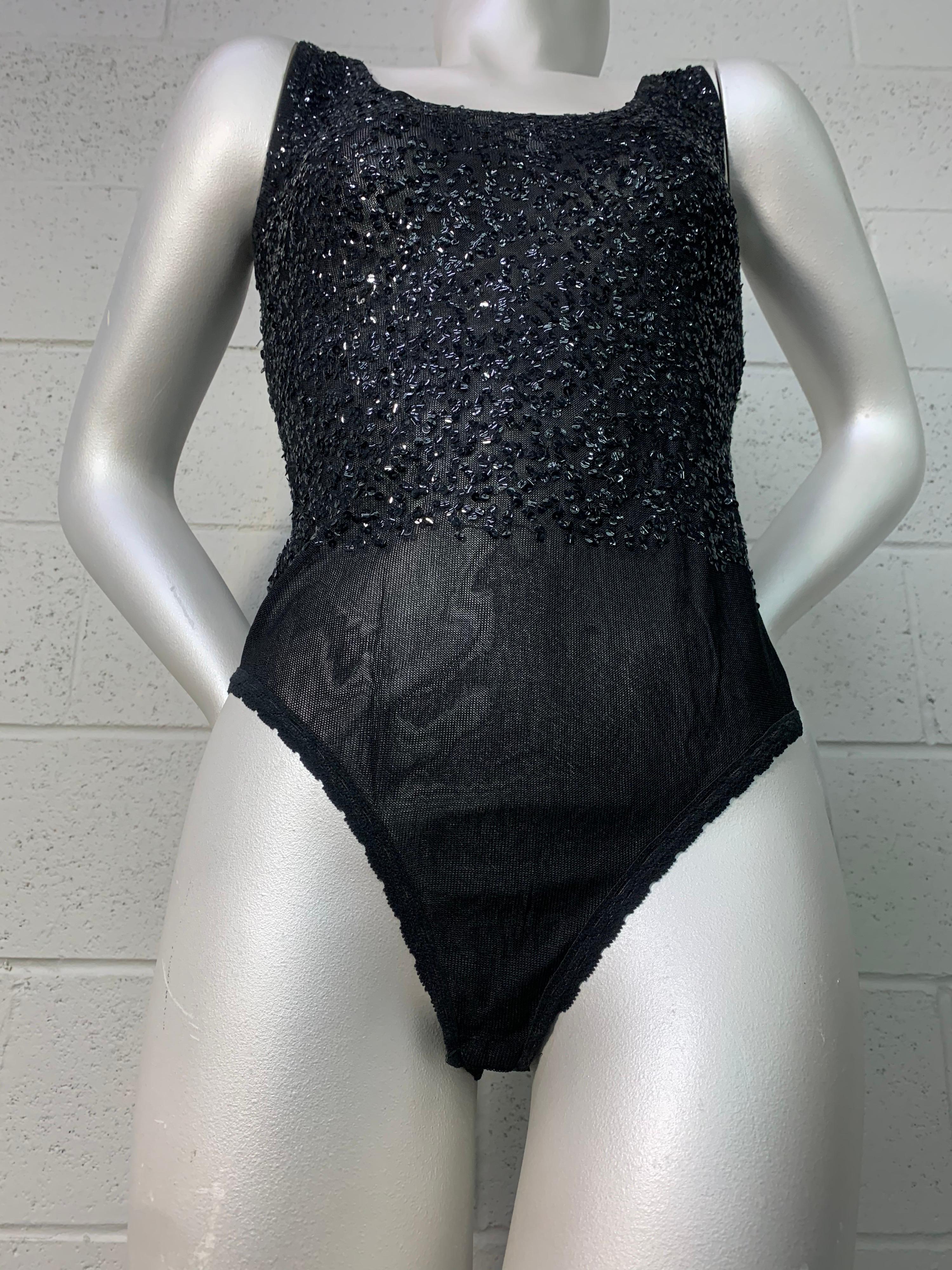 A sexy 1990s Donna Karan sheer black bodysuit with applied black sequin work on entire bodice. Get your Glamazon on! Snap crotch closure. Size Medium.
