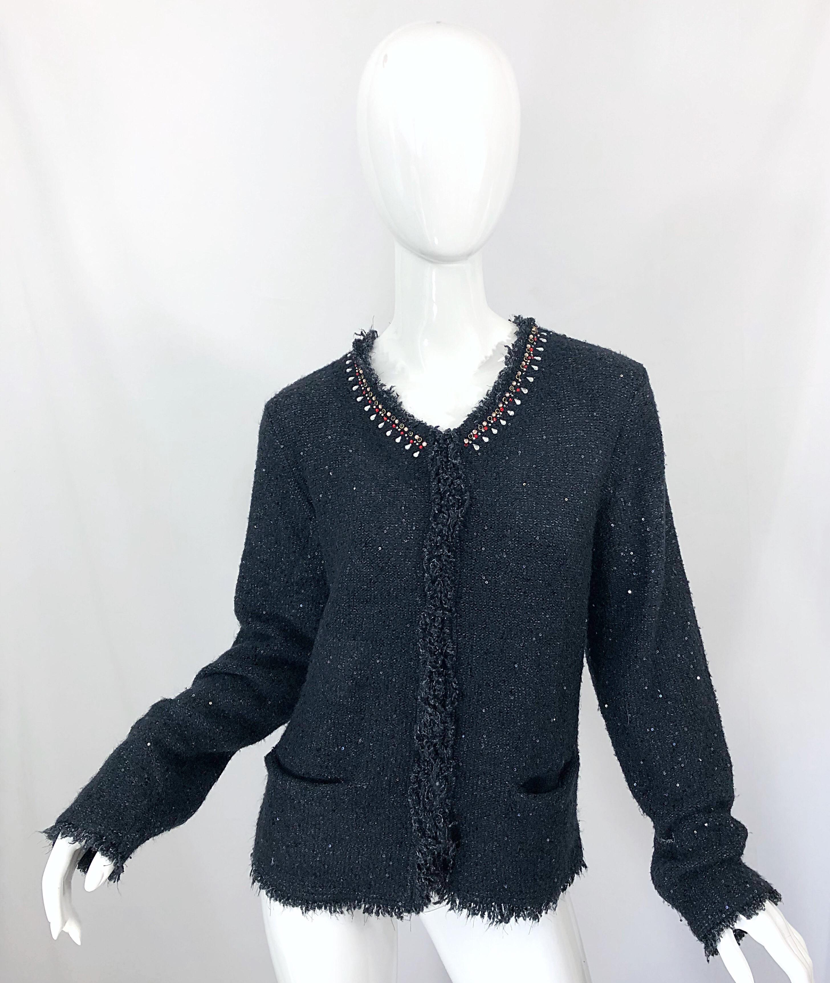 Beautiful 90s DONNA KARAN sequined, beaded and rhinestone long sleeve black cardigan. Soft blend of acrylic, nylon and spandex feels amazing against the skin. POCKET at each side of the waist. 
Hidden hook-and-eye closures up the front. Hundreds of