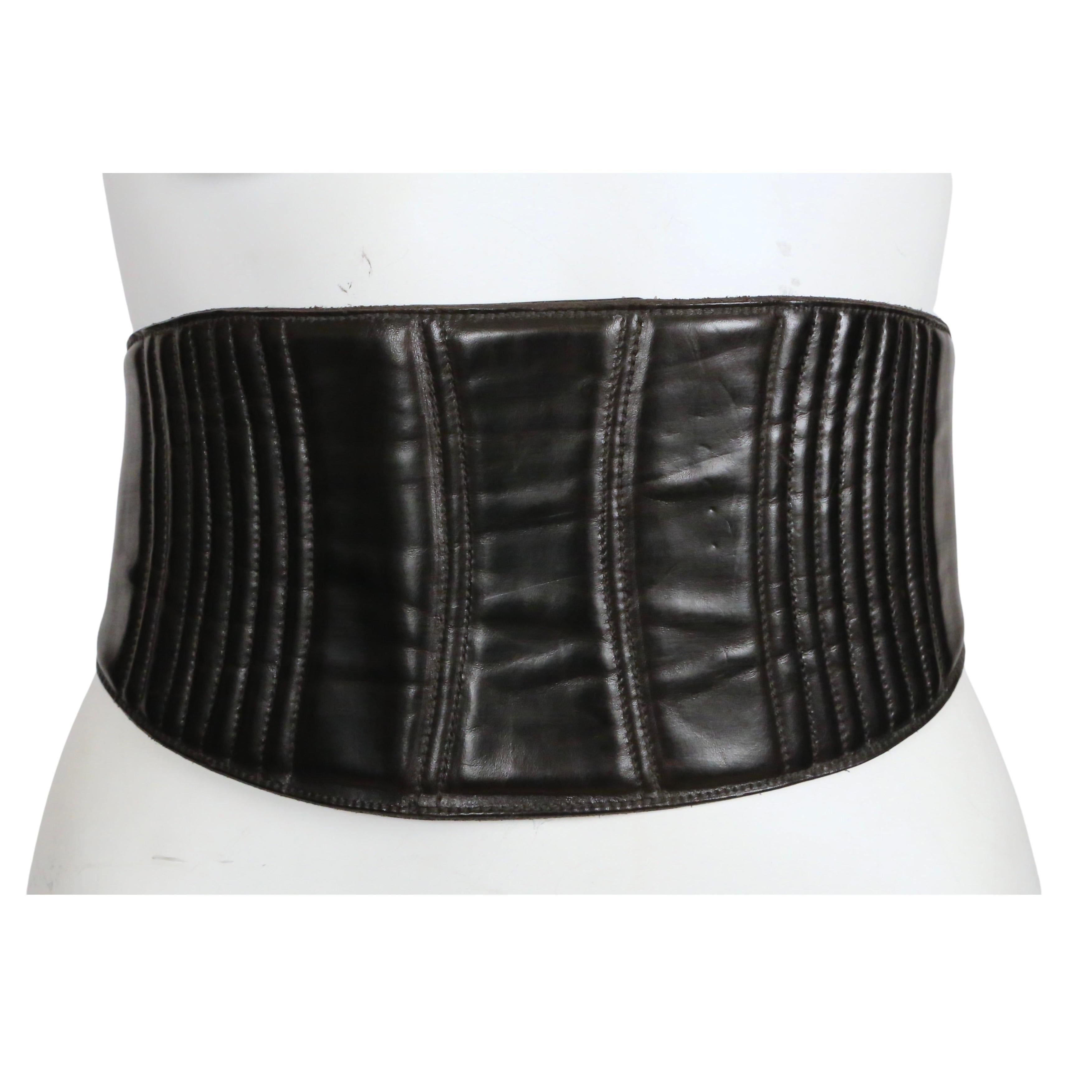 Very rare, black leather belt with lace up corset detailing designed by Dries Van Noten dating to the late 1990's. Size 70. Belt measures approximately: just under 5.5