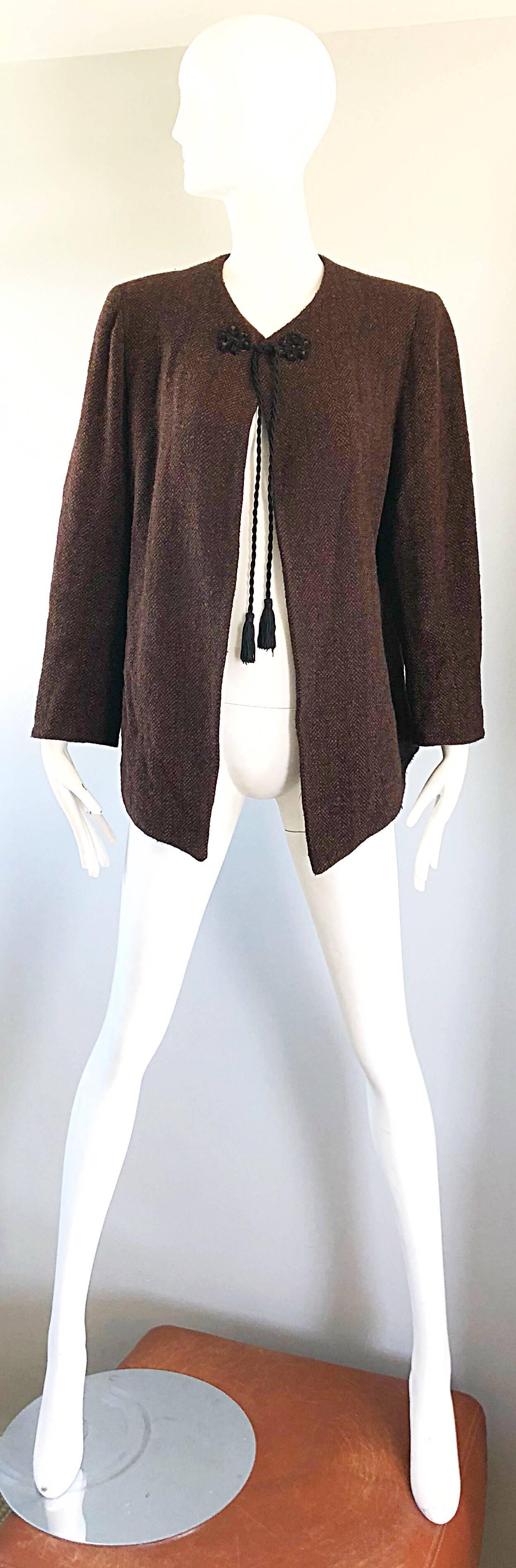 Chic 1990s EMANUEL UNGARO brown and black swing jacket coat! Features a soft brown wool with specs of color throughout. Russian inspired tassel detail at center neck. Swing style is easy to wear and super versatile. Fully lined in silk chiffon.