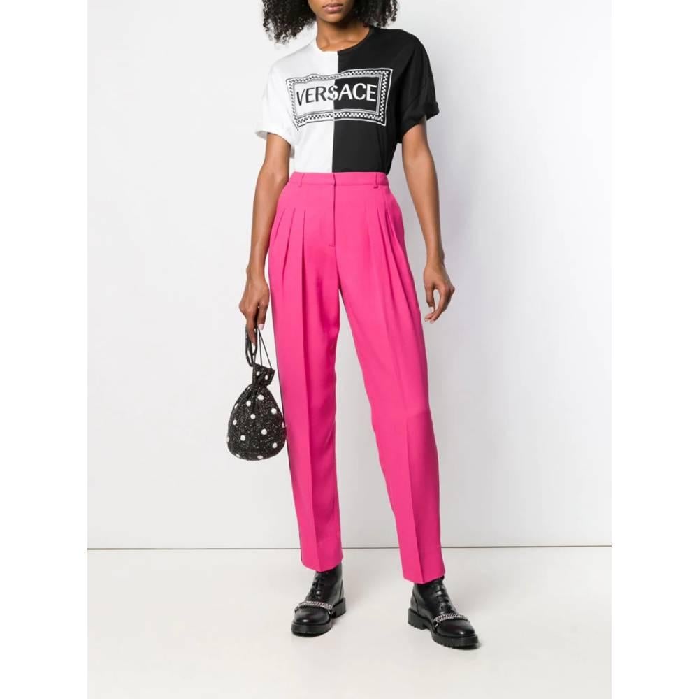 Emanuel Ungaro straight pants. High waist model and belt loops, hidden front closure with zip and hook. Side welt pockets, decorative pleats and black side band.

The product has some threads slightly pulled on the back and a little halo as shown in