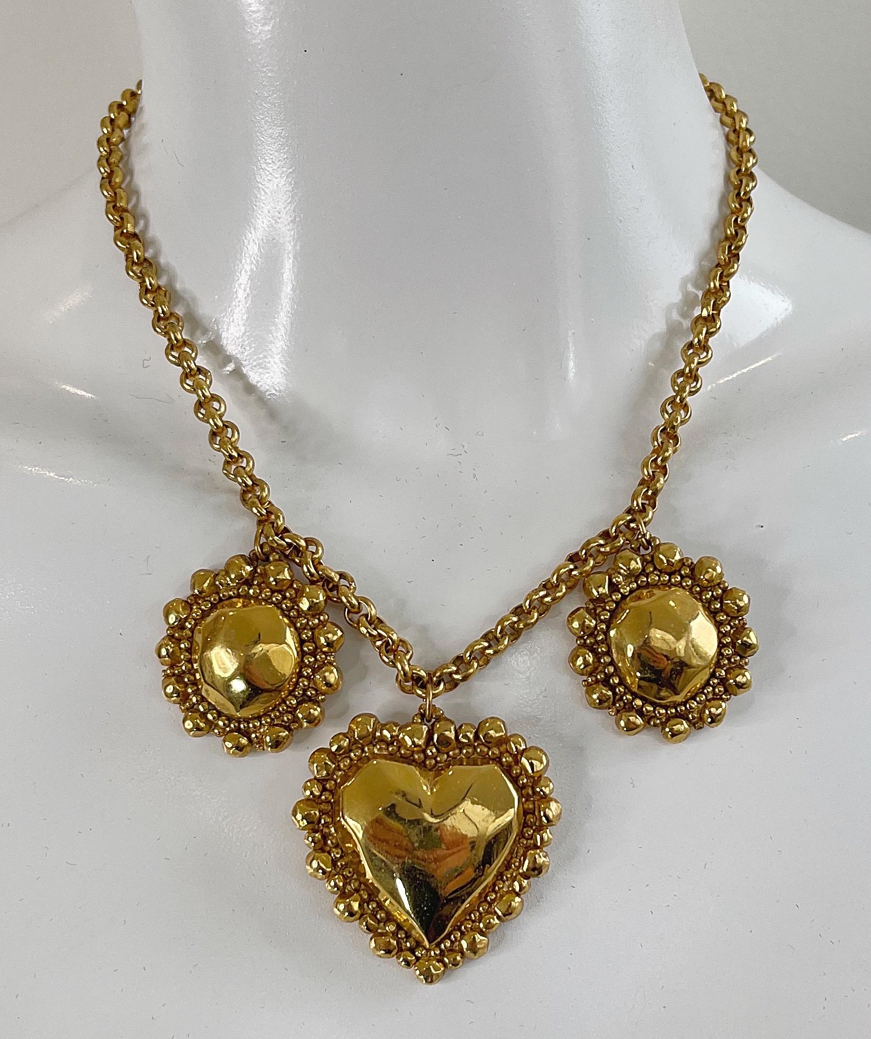  Valentine Day February 14 Chic 1990s EMANUEL UNGARO gold plated heart pendant necklace ! Center pendant is heart shaped with two round pendants on each side. 
Can easily be dressed up or down. Pair with jeans and a tank or a dress.
In great unworn