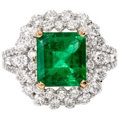 1990s Emerald Diamond 18 Karat White Gold Cocktail Ring
