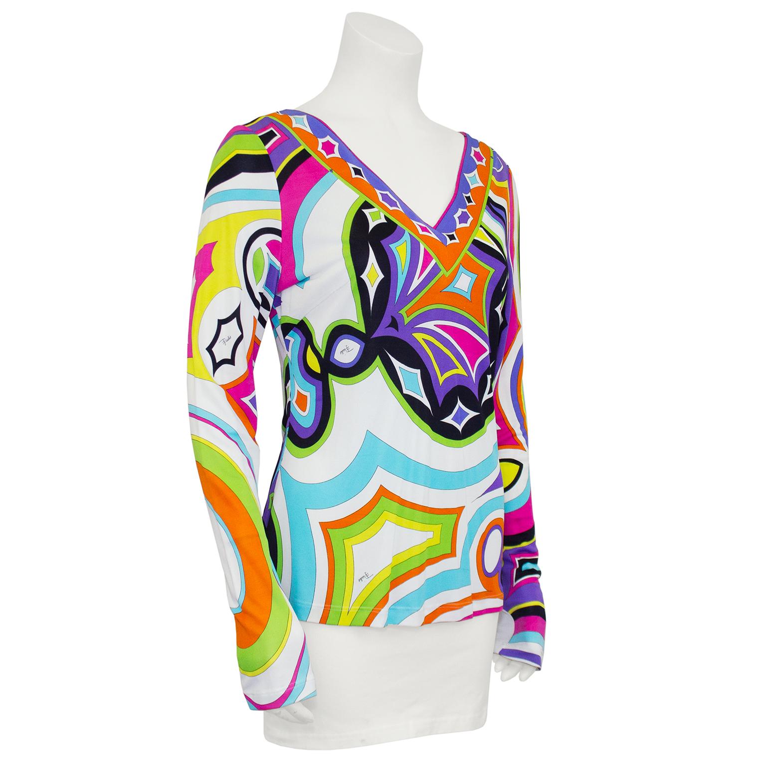 Fun & vibrant Emilio Pucci top from the 1990s. This top features the iconic Pucci abstract print in very bright colors. V neckline with long sleeves. Signed fabric, made in Italy. Fits like a US size 6. The perfect summer evening top. Dry cleaned