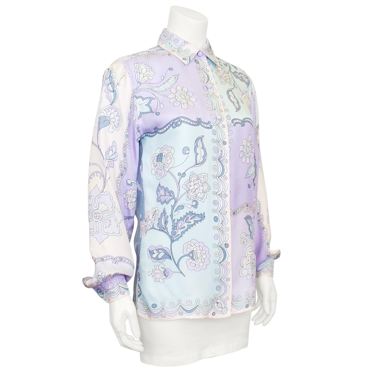 Emilio Pucci silk shirt from the 1990s. A pastel mix of pale purples, blues and pinks in an abstract 1960's inspired floral print. Billowy bishop sleeves and slits at hem of both side seams for a relaxed look. Signed fabric. Excellent vintage