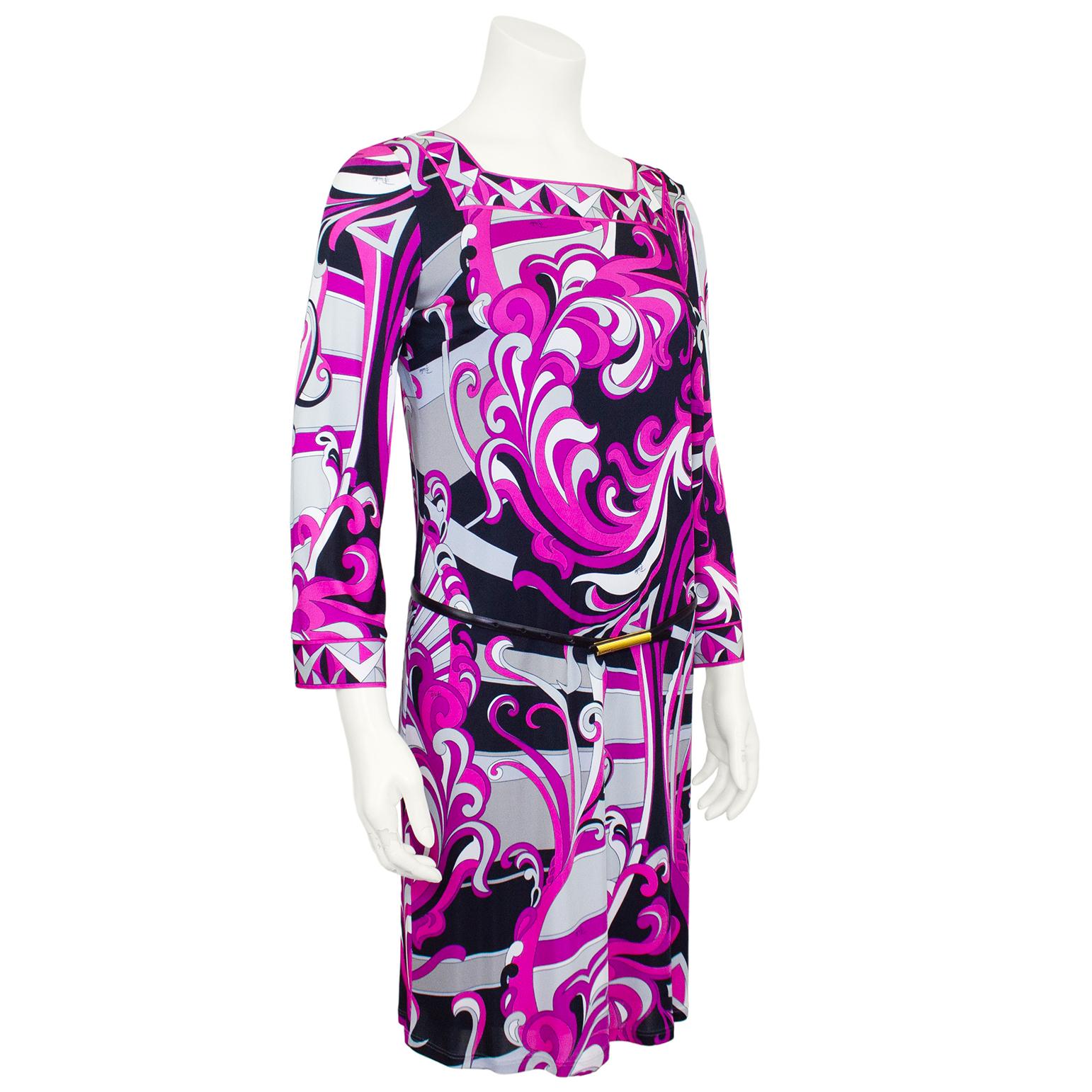 Emilio Pucci printed lycra dress from the 1990s. Abstract swirling pink, grey and black floral print all over with geometric trim at the neckline and cuffs. Square neckline and slightly bell shaped long sleeves. Thin black leather belt with gold