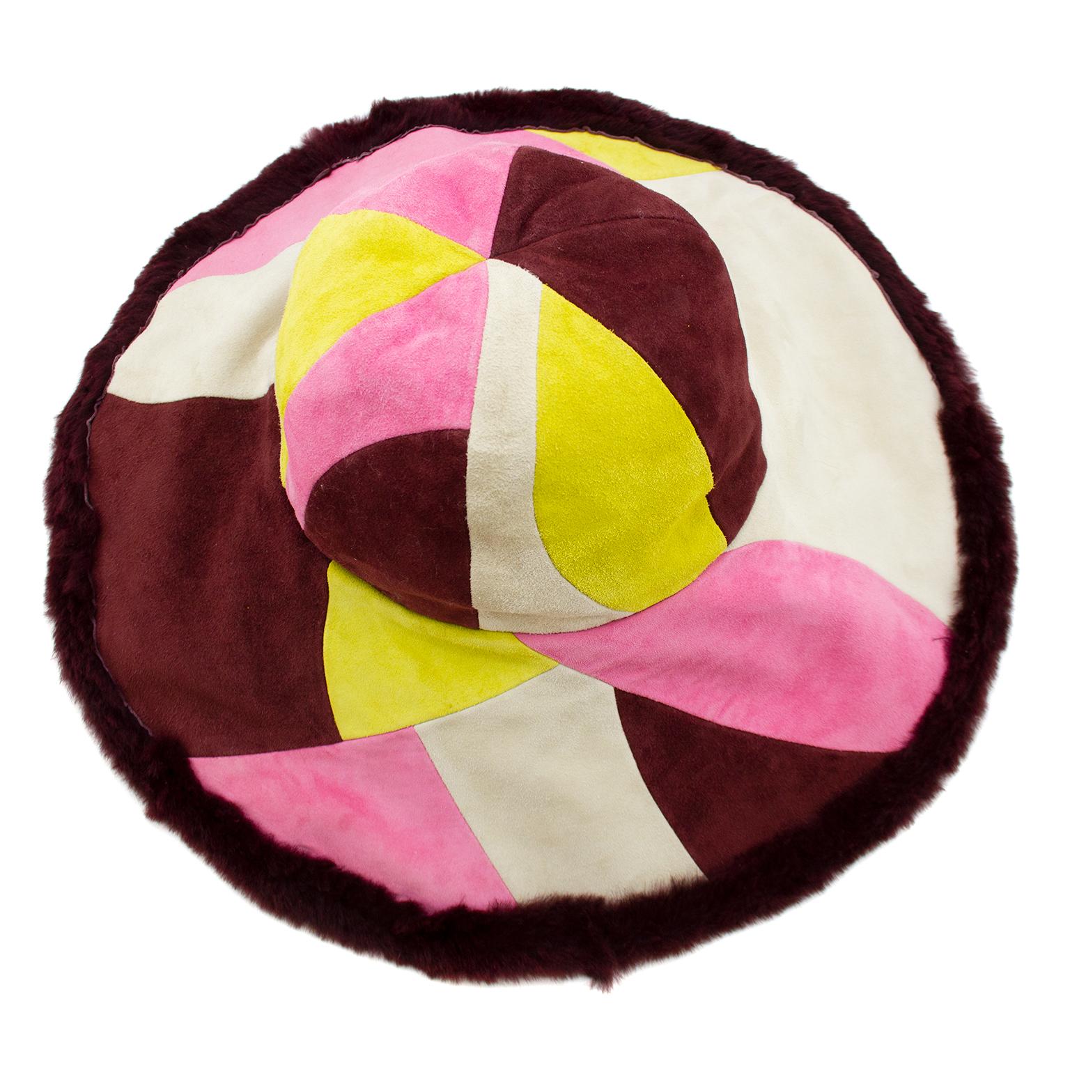 1990s Emilio Pucci six panel wide brim hat. The iconic Pucci pattern made out of patchwork suede in pink, cream, maroon and yellow. Maroon sheared rabbit trim and interior. Very chic winter chapeau. Made in Italy. Excellent vintage condition - tags