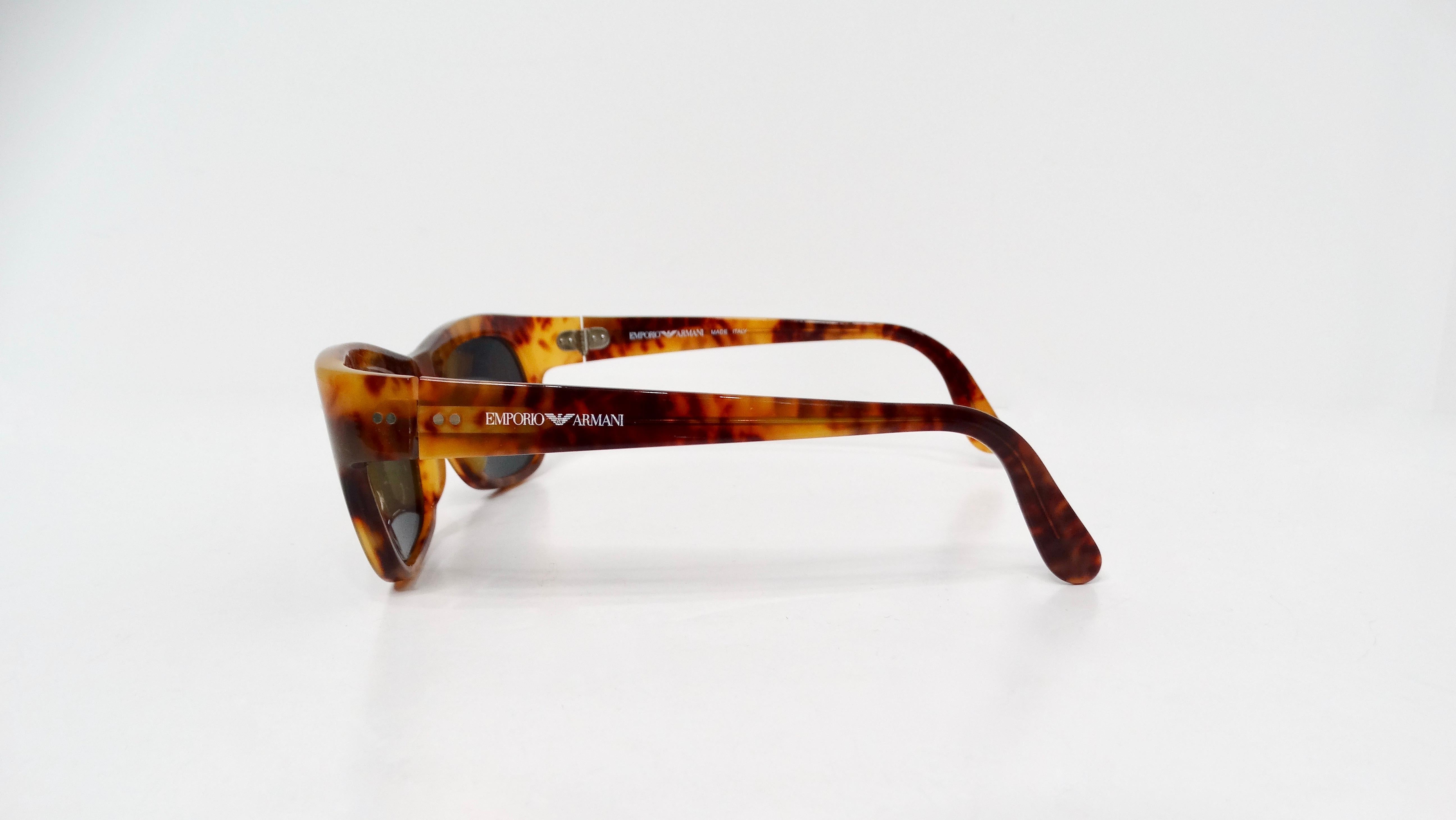 The 1990s Emporio Armani Brown Tortoise Wayfarer Sunglasses embody a perfect fusion of retro charm and timeless sophistication, making them a quintessential accessory for fashion enthusiasts. Crafted with attention to detail, these sunglasses