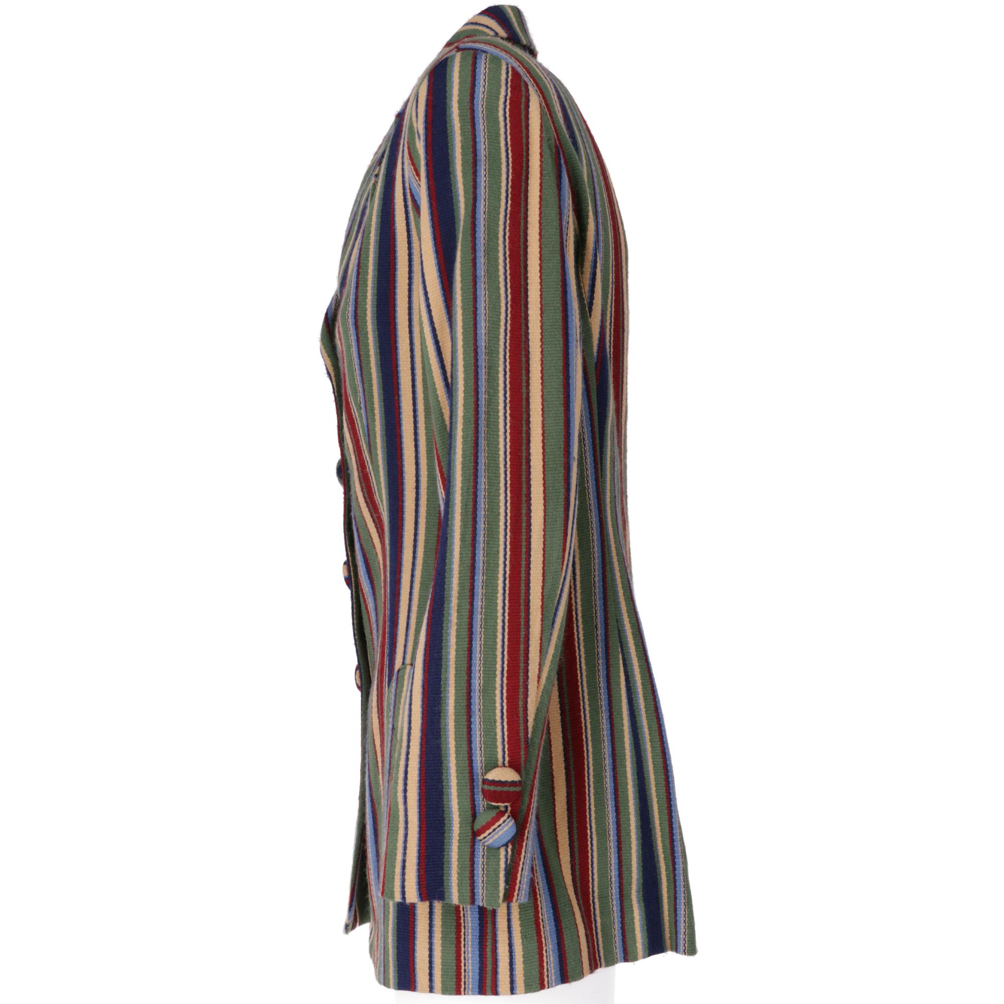 Enrico Coveri blazer in multicolored vertical striped wool, with classic reverse collar, padded shoulders, long sleeves, front closure with buttons covered with the same fabric as the jacket, two welt pockets. Lined

The jacket has fading in the