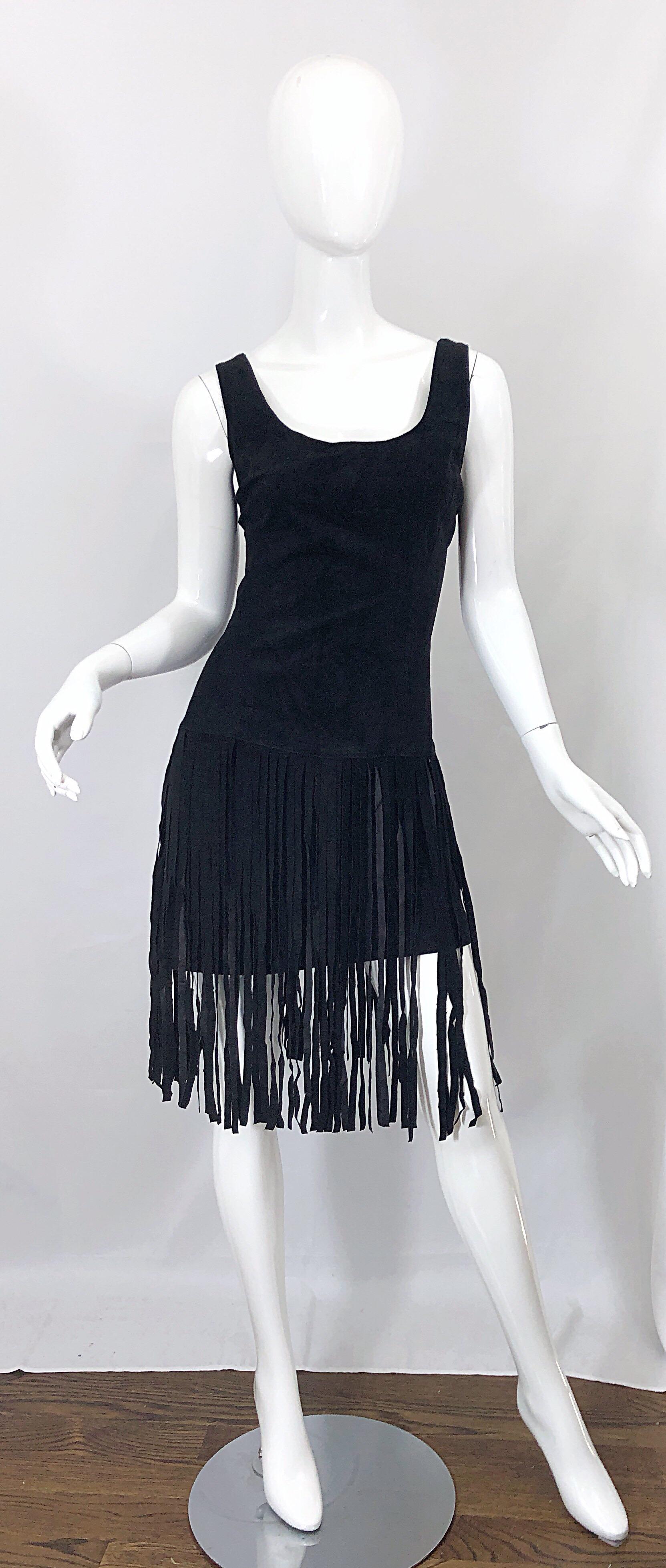 Amazing EREZ for LILLIE RUBIN Size 10 black suede leather fringe mini dress! Features a flattering tailored body with black suede fringe that is sewn on the low waistband. Fully lined. Hidden zipper up the back with hook-and-eye closure. The perfect