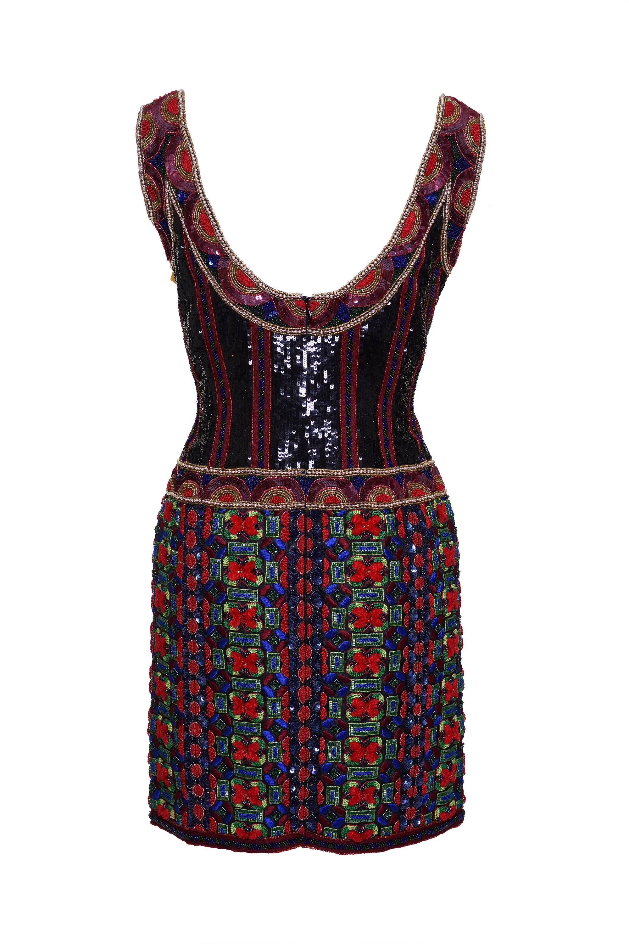 This amazing 1990s embroidered dress by Escada Couture has a special floral and geometric design with pearls, cup sequin, flat sequin, seed bead and seed bugle beads on different colors such as gold, red, blue, green and black on a mix of different