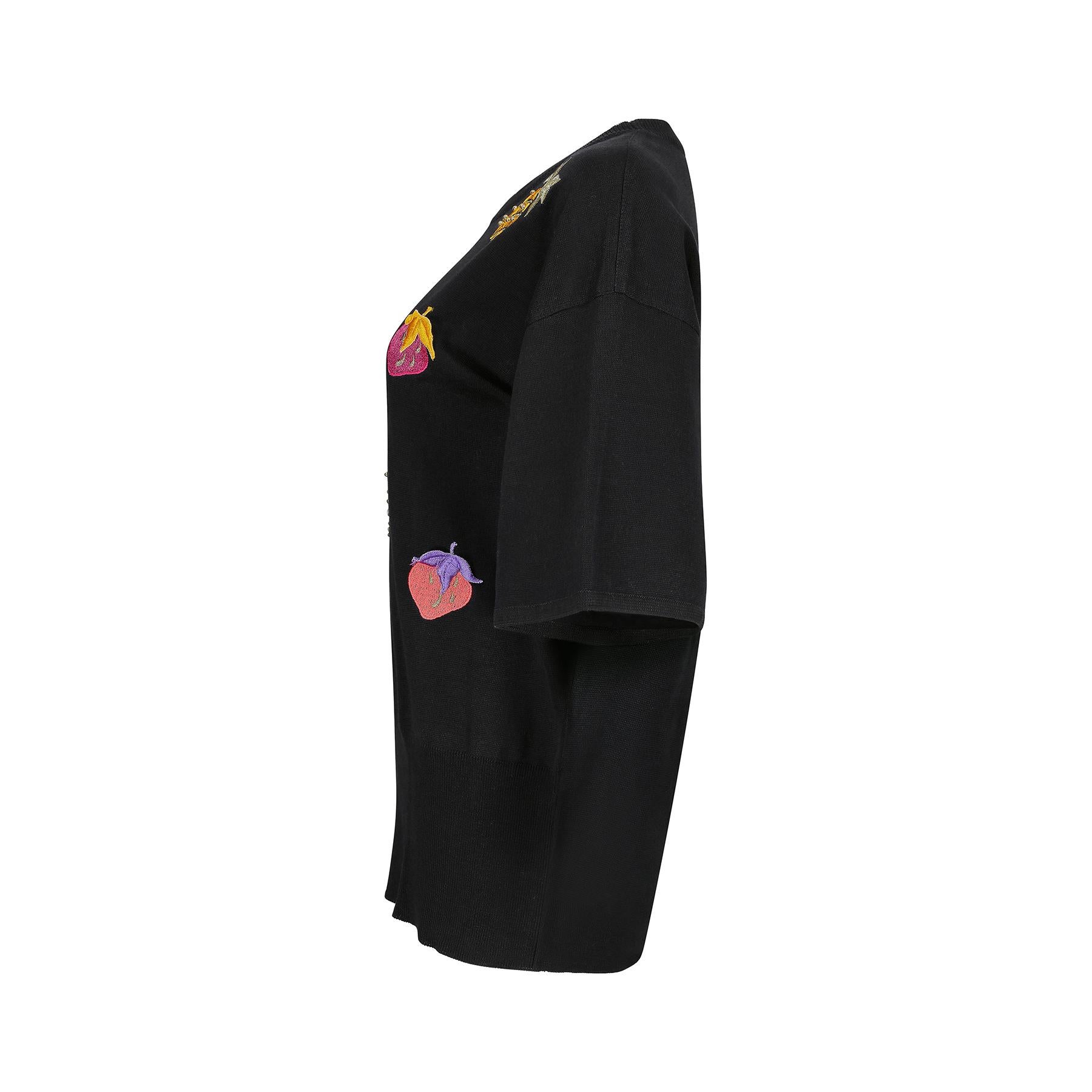 This is a really fun 1990s piece by Escada when they were very high profile and considered a luxury brand. The novelty 'fruit salad' design is of embroidered motifs that represent strawberries and pineapples in a pink, yellow, purple, and russet