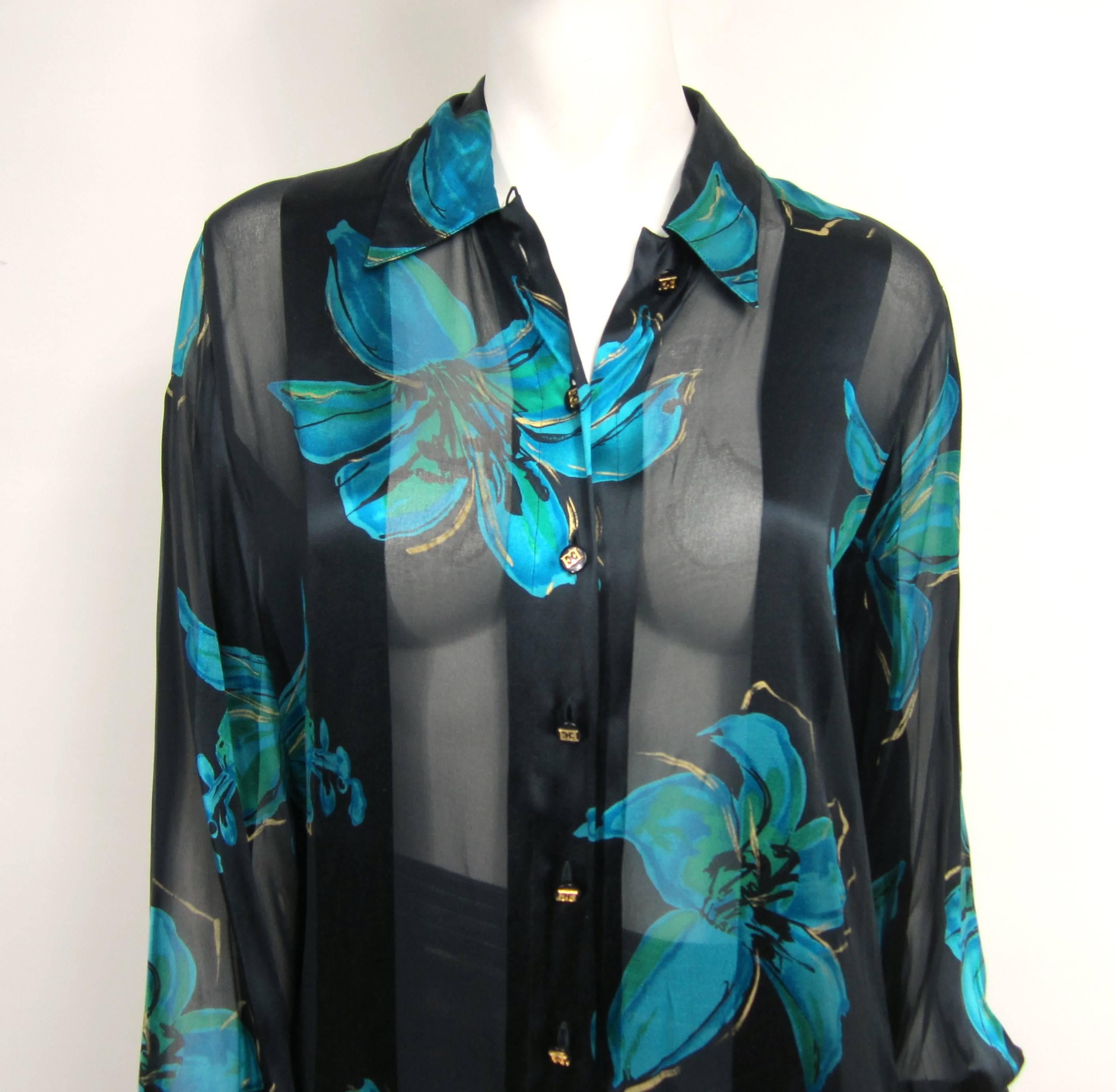 Escada Silk Blouse with Blue floral detailing. This is our of a massive collection of jewelry and clothing that was purchased in  the late 1980s early 90s, stored away and never worn. Check our store front as we have hundreds of items that are from