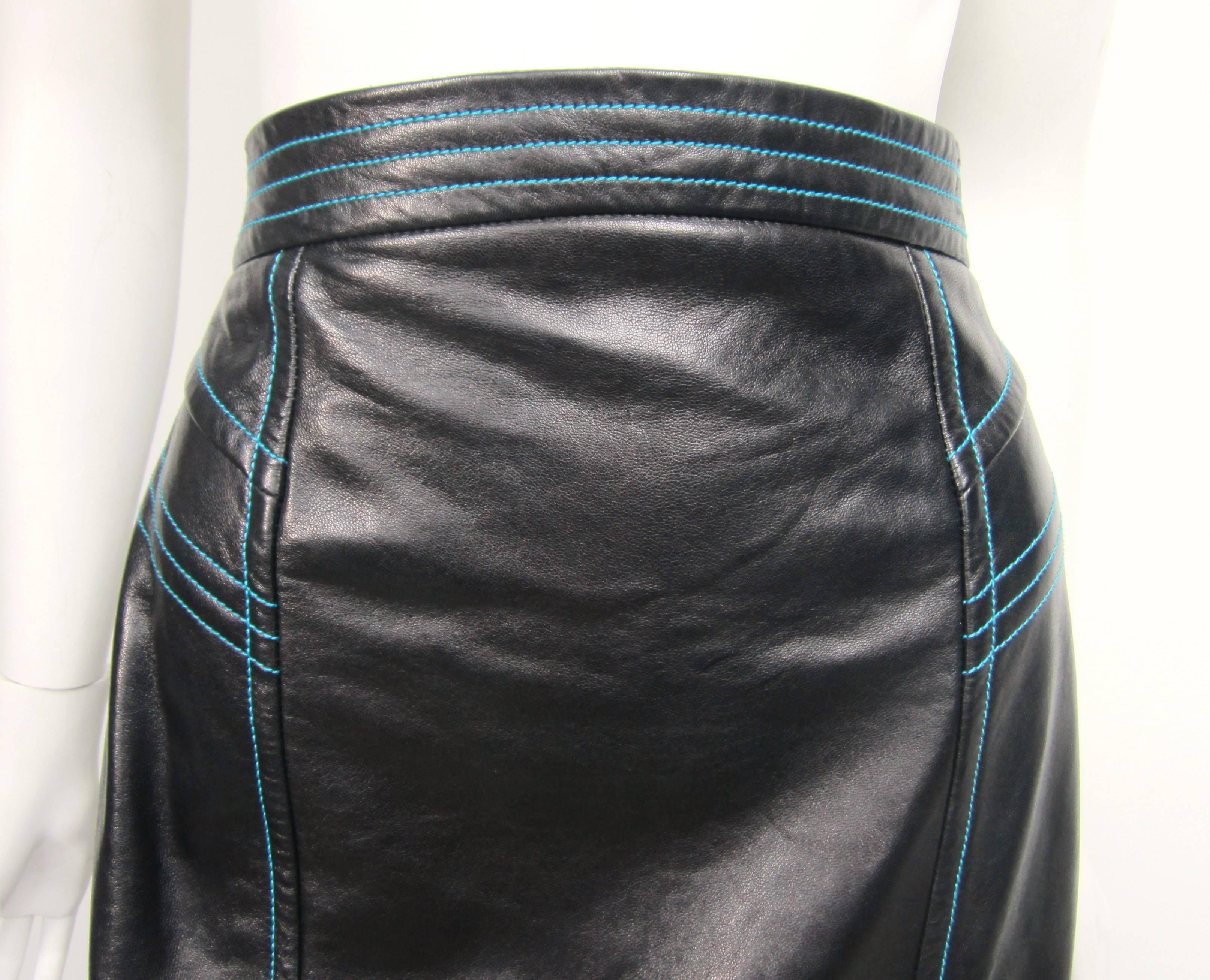 Stunning Black Leather Escada Leather Pencil skirt with Blue stitching detailing. Kick pleat in the back. Closure is a snap and button. This is out of a huge collection of clothing and jewelry that was purchased in the late 1980s early 1990s and