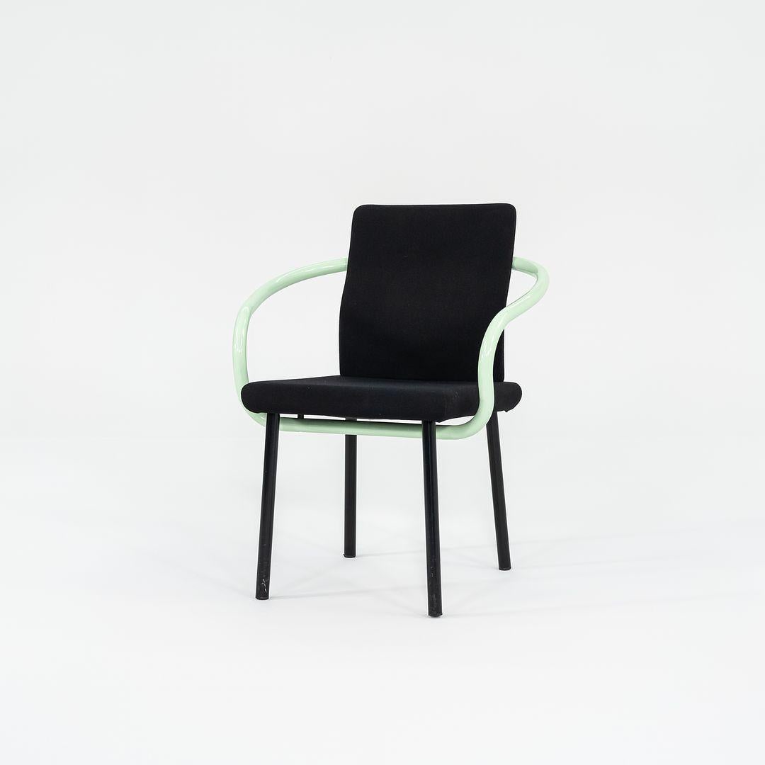 This is a Postmodern armchair, initially designed by Ettore Sottsass for Knoll in 1986. These examples date to the 1990s, and the listed price includes one chair. We have three chairs available for purchase in this colorway. Their design features