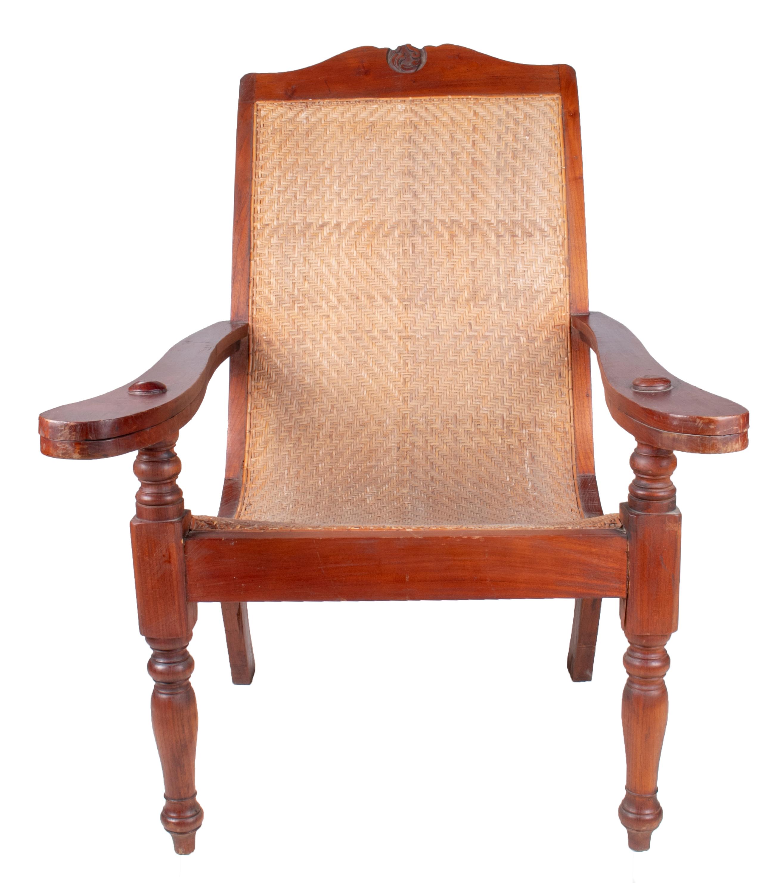 1990s European mahogany rattan lace cane armchair.