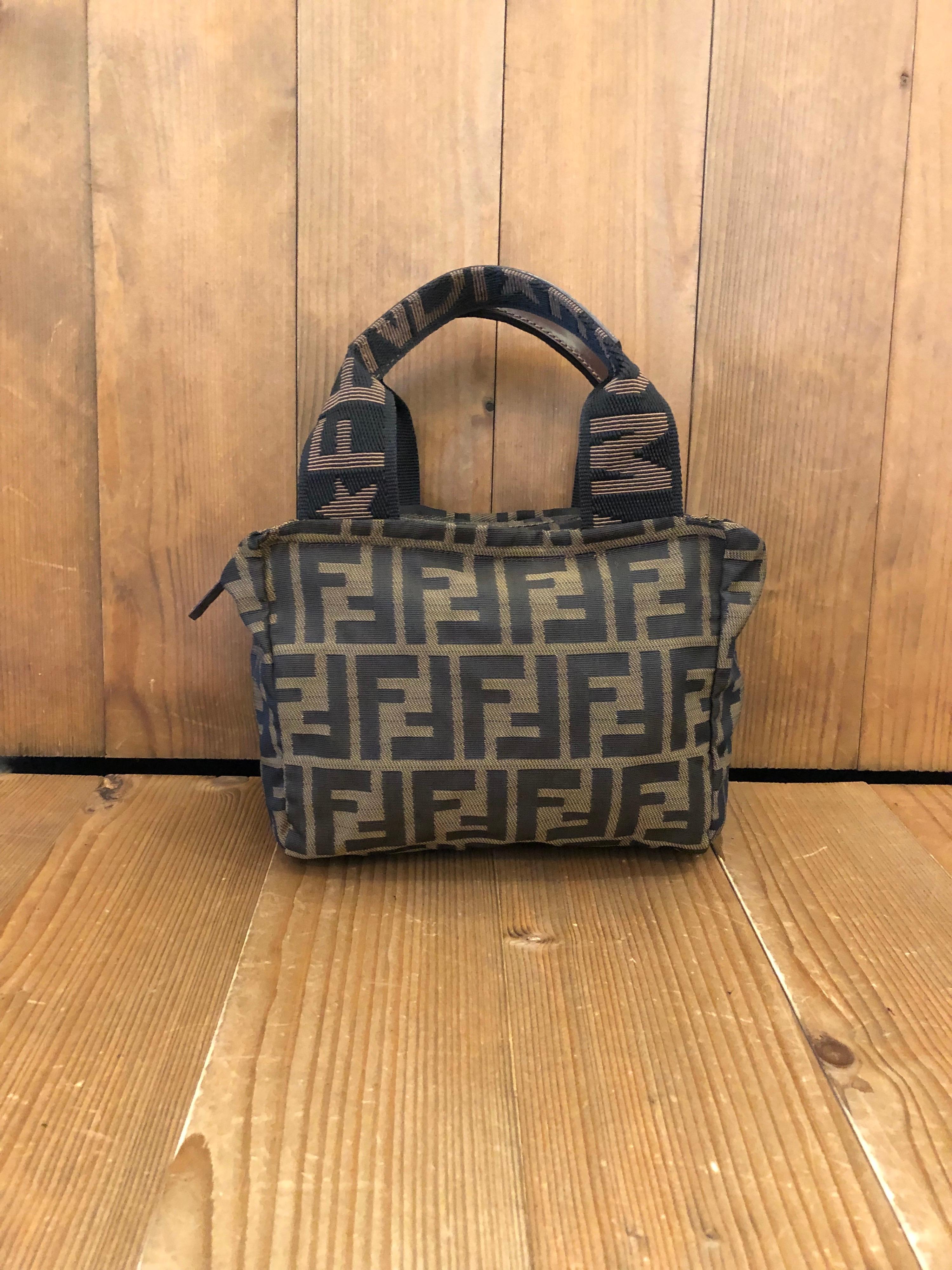 Vintage Fendi mini tote bag in Fendi's iconic zucca jacquard featuring leather trimmed handles. Made in Italy. Measures 7 x 5.75 x 3.5 inches Handle Drop 4 inches (fits plus-sized iPhone)

Condition: Minor signs of wear. Generally in good condition.