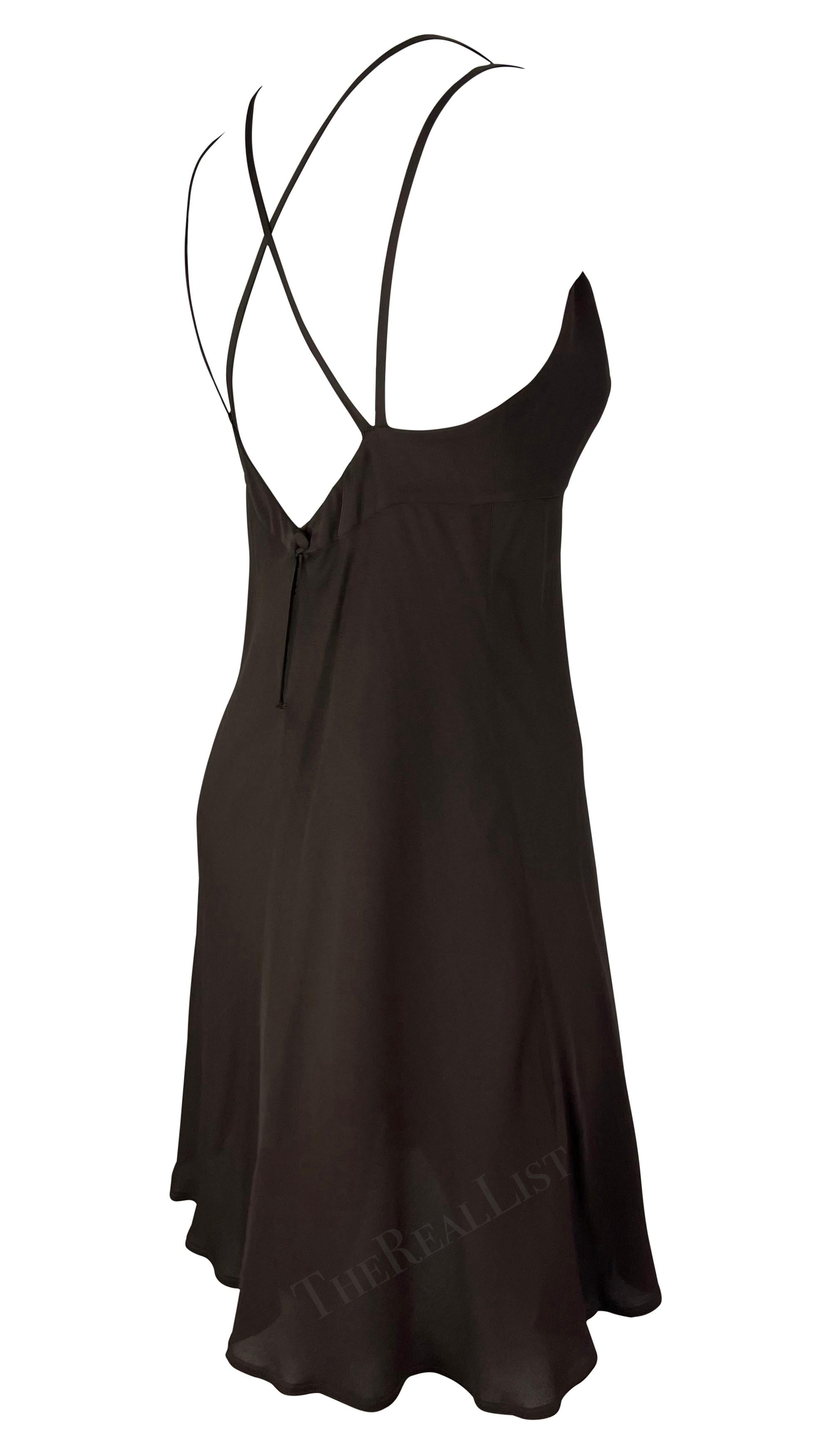Presenting a girly brown Fendi mini dress, designed by Karl Lagerfeld. From the 1990s, this dress features a scoop neckline, distinctive double shoulder straps that cross over an exposed back, and a soft flare at the hem. A must-have, this dress