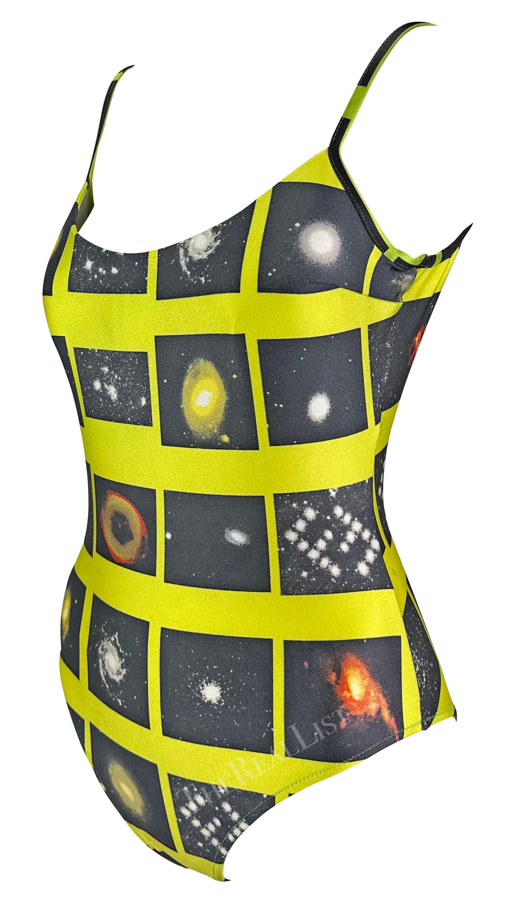 Presenting a chic bright yellow galaxy-motif Fendi one-piece swimsuit, designed by Karl Lagerfeld. From the 1990s, this sexy yellow bodysuit is covered in portraits of different galaxies and is made complete with a low back. 

Approximate