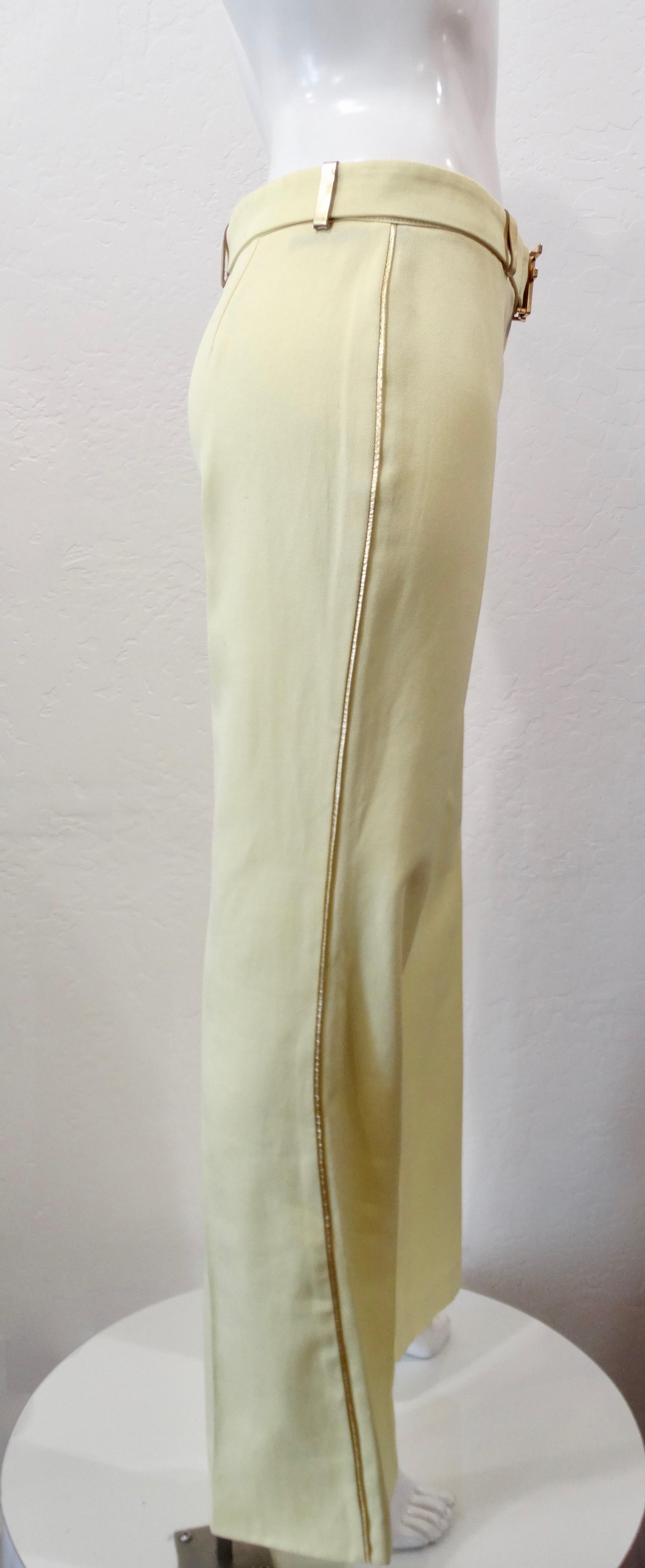 Add a little color to your wardrobe with these amazing Fendi slacks! Circa 1990s, these pants are a soft pastel yellow color and feature gold metallic leather piping down the sides and on the belt loops. Includes a tonal belt with a Fendi logo