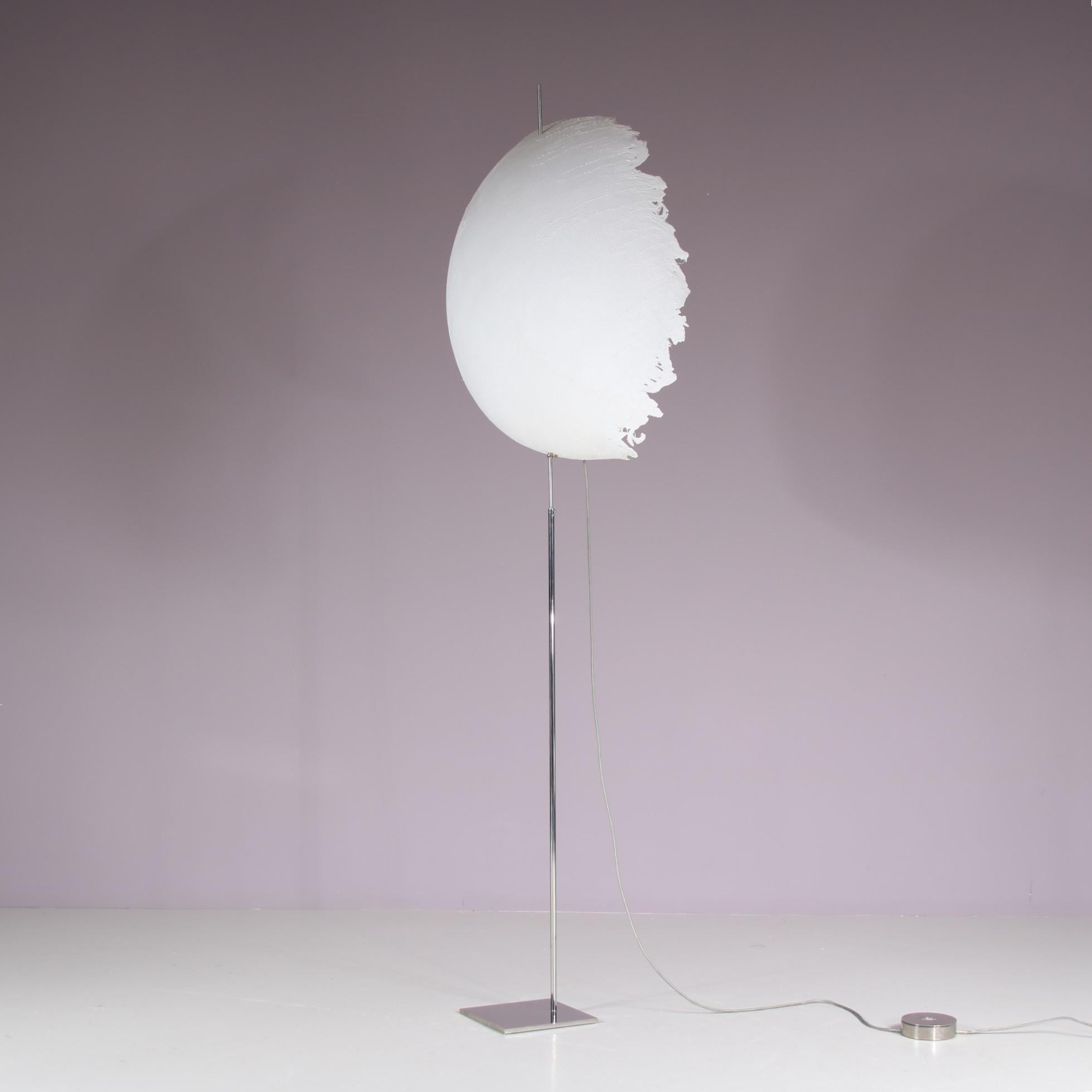 A very rare floor lamp, model “Postkrisi F 60”, manufactured by Cattelani & Smith in Italy around 1990.

The piece has a minimalist, chrome plated metal base on a flat food and round matching dimmer. The eye-catching feauture of this piece is the