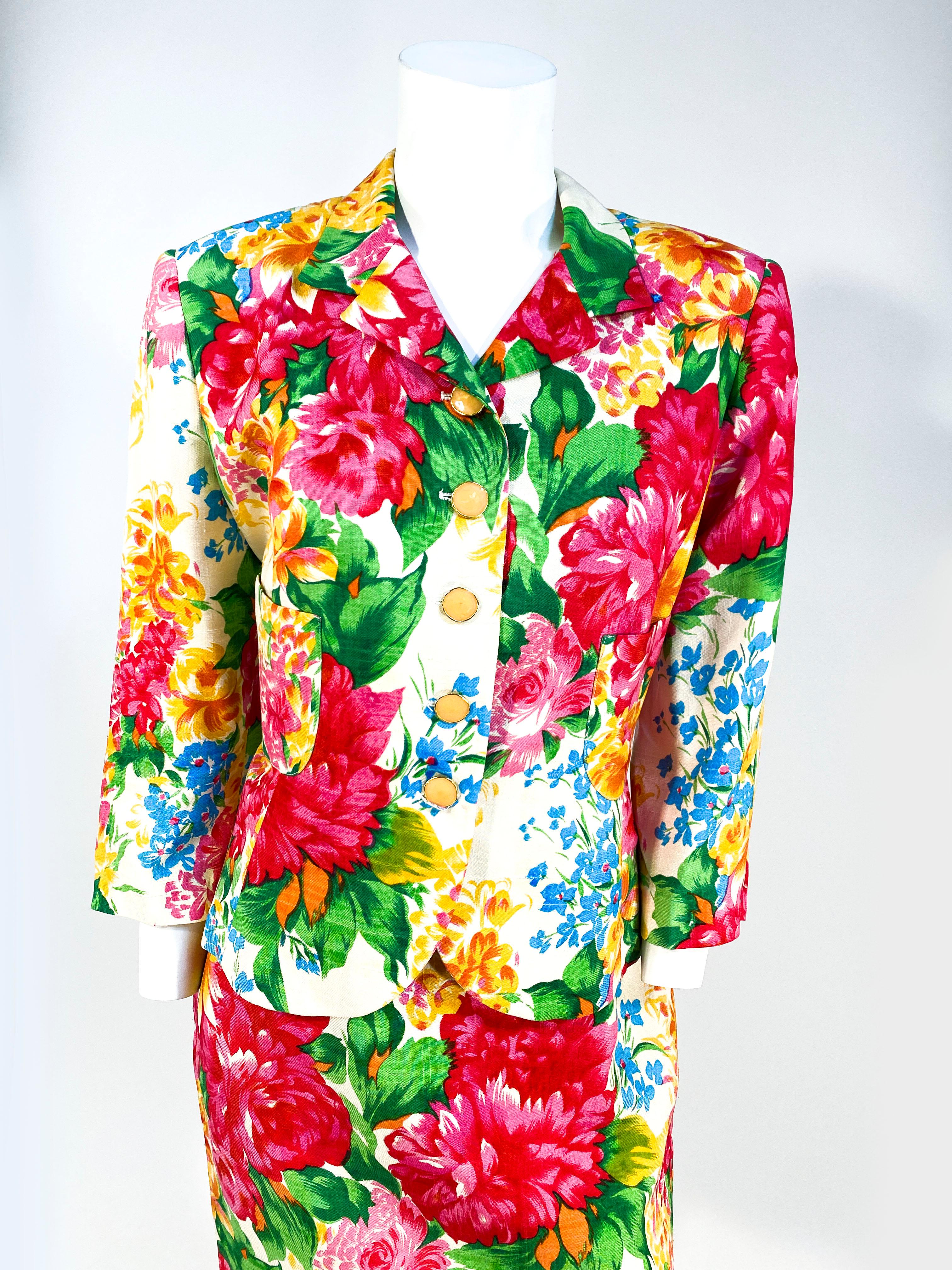 1990's Flora Kung floral printed raw silk suit with enamel buttons, silk lining, padded shoulders, modest lapels, and bracelet-length sleeves. 