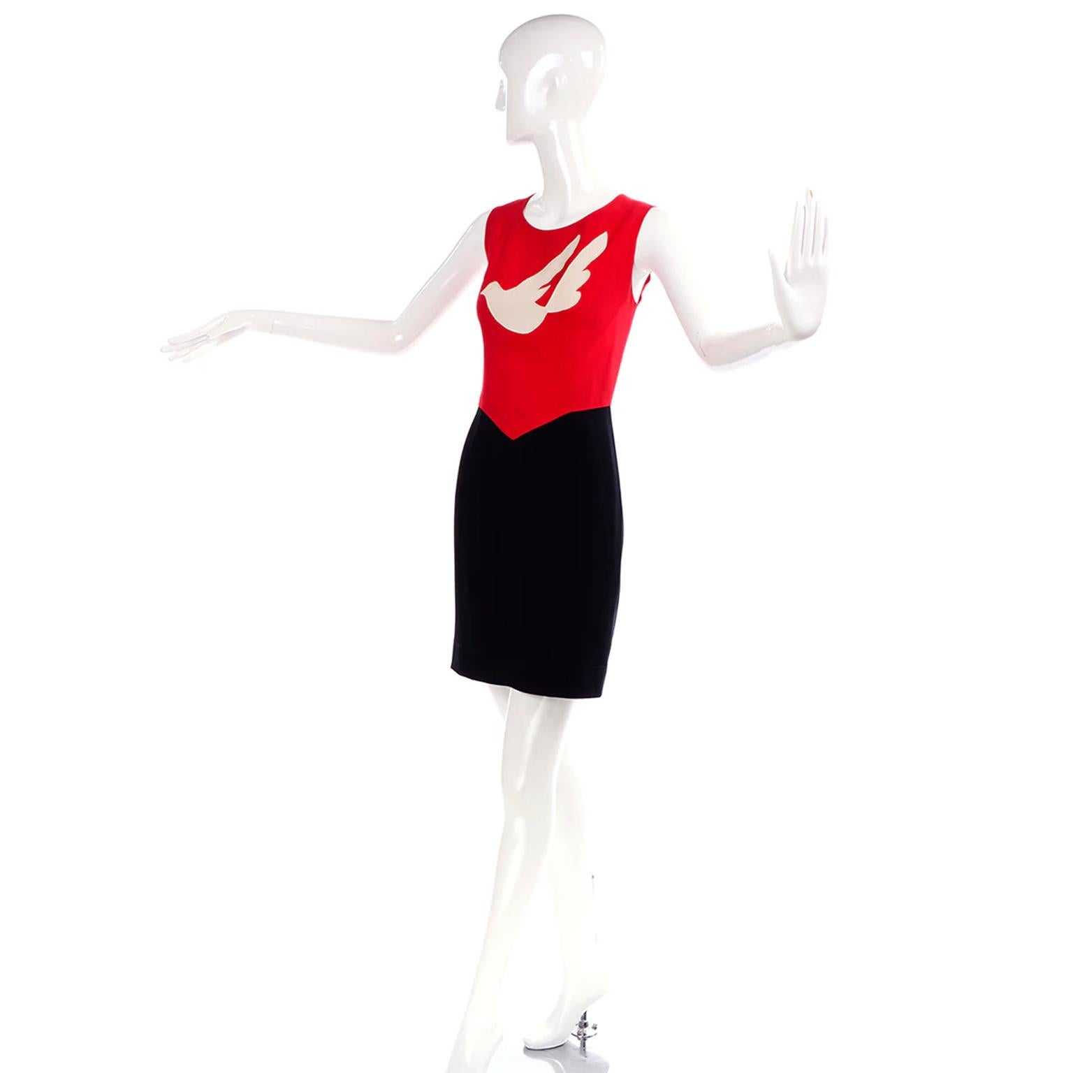 This vintage 1990's Franco Moschino red and black sleeveless dress features a beautiful cream dove appliquenon the front of the bodice.	Franco Moschino was truly a philosopher and observer of life and his pieces, though often humorous, sometimes