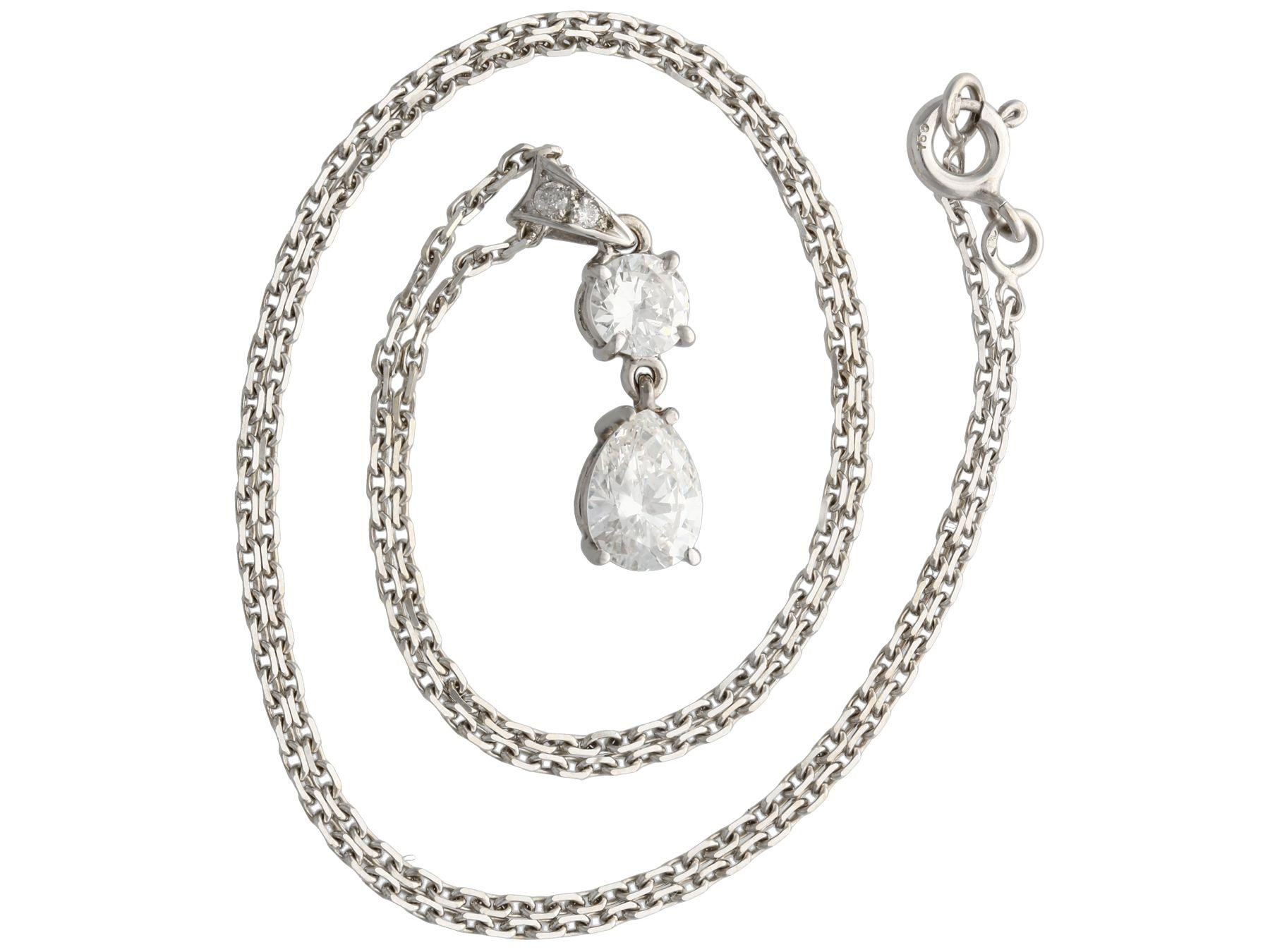 A stunning vintage French 1.55 Ct diamond and 18k white gold pendant and chain; part of our diverse diamond jewelry and estate jewelry collections.

This stunning, fine and impressive vintage pear cut diamond pendant has been crafted in 18k white