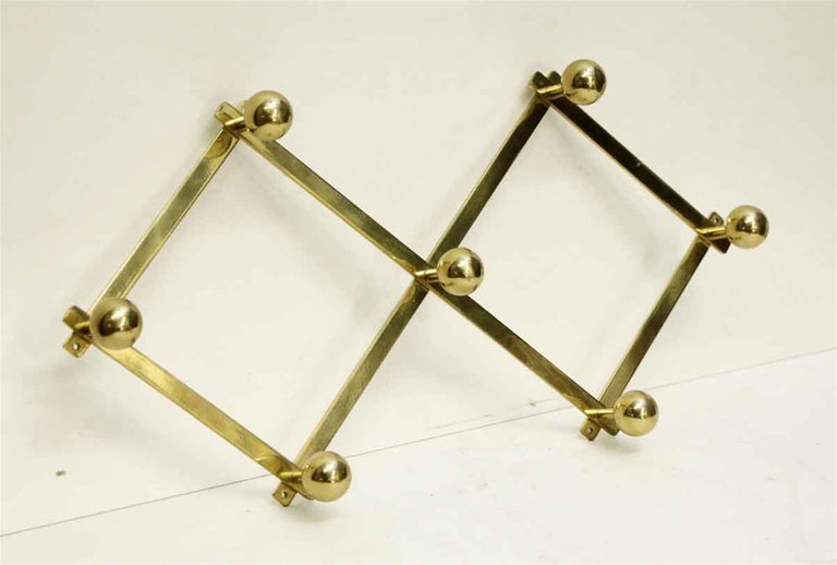 1990s French Brass Accordion Wall Rack with Seven Ball Hooks at 1stDibs
