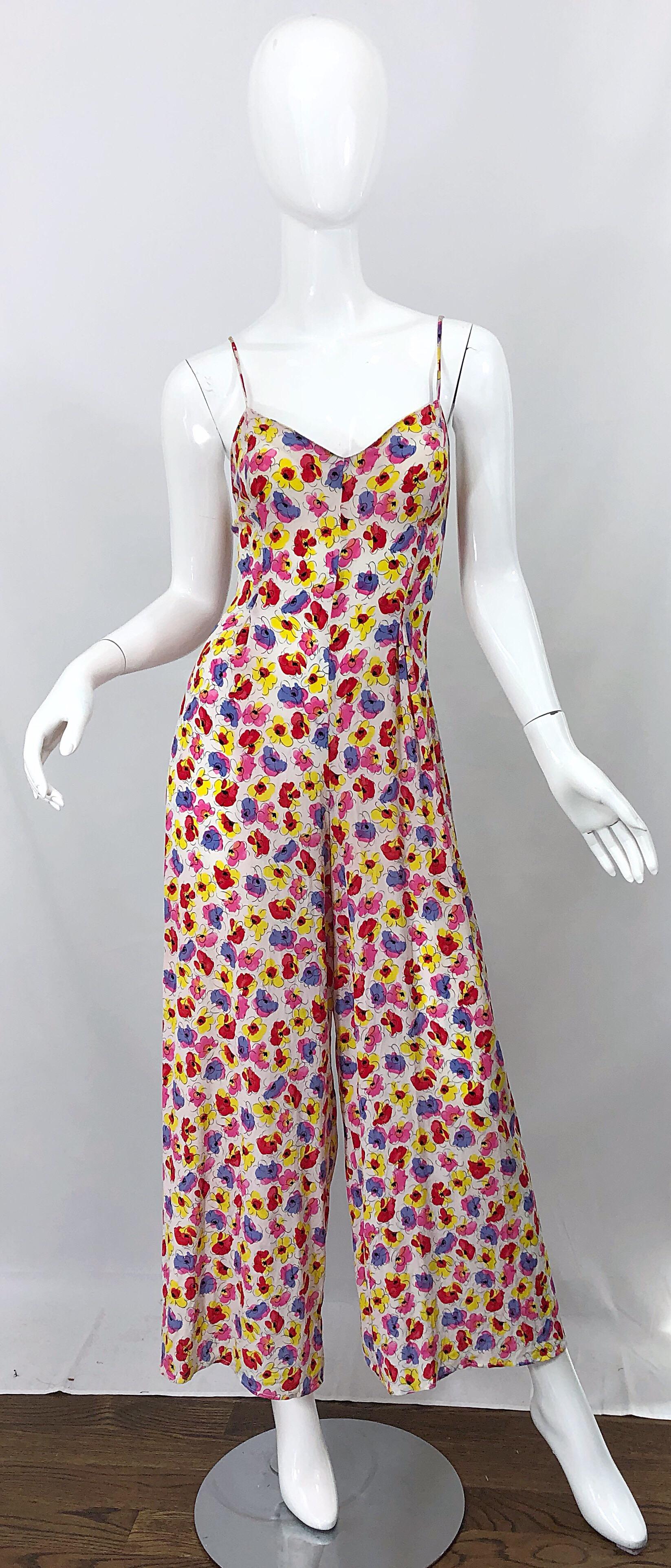 Chic 1990s French designer wide leg rayon jumpsuit! Features flowers in vibrant colors of pink, purple, red, yellow and white. Fitted spaghetti strap bodice with flattering wide legs. Hidden zipper up the back. Great belted or alone for any day or