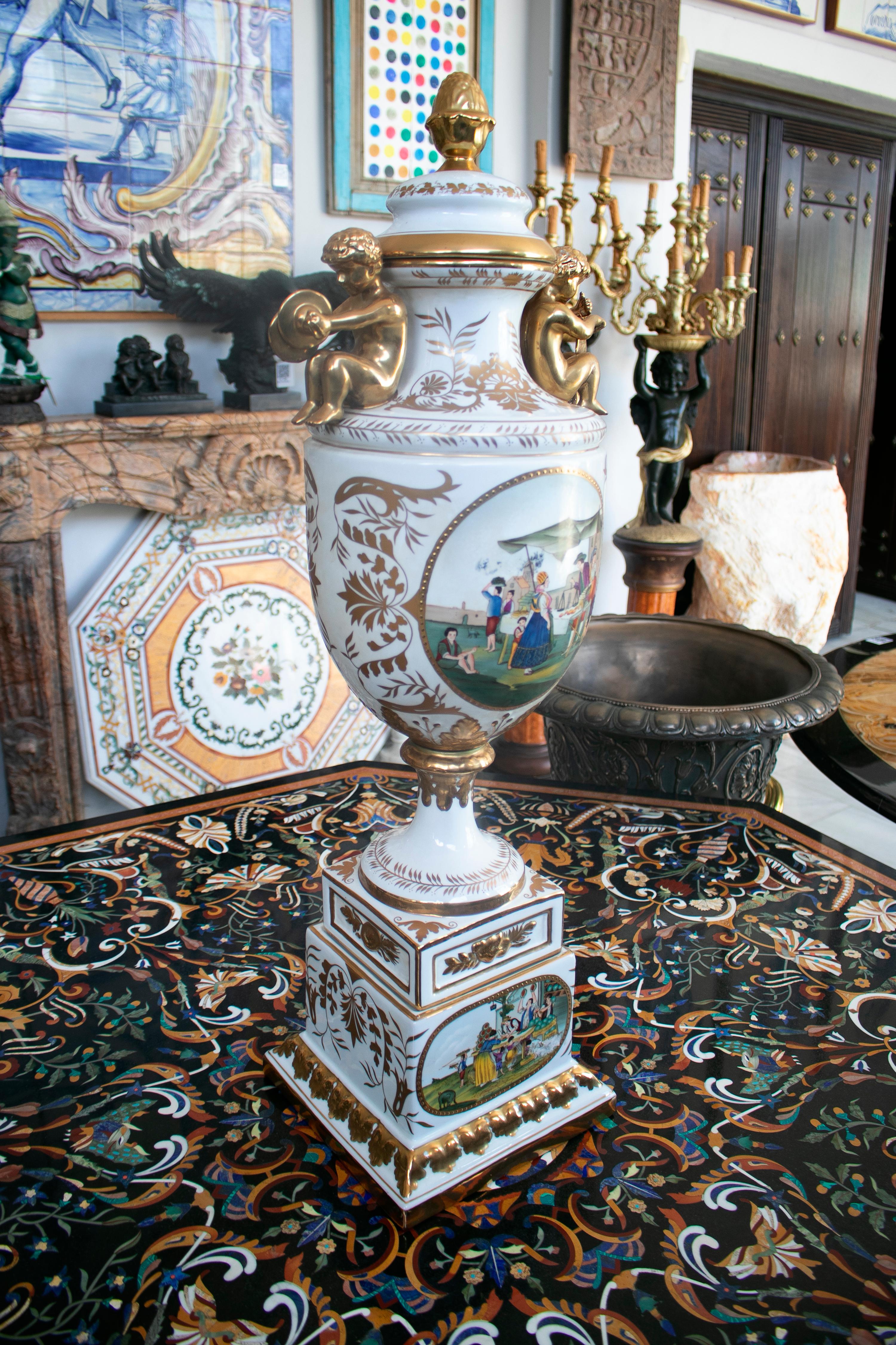 1990s French golden painted white porcelain table centerpiece vase with people scene.

  