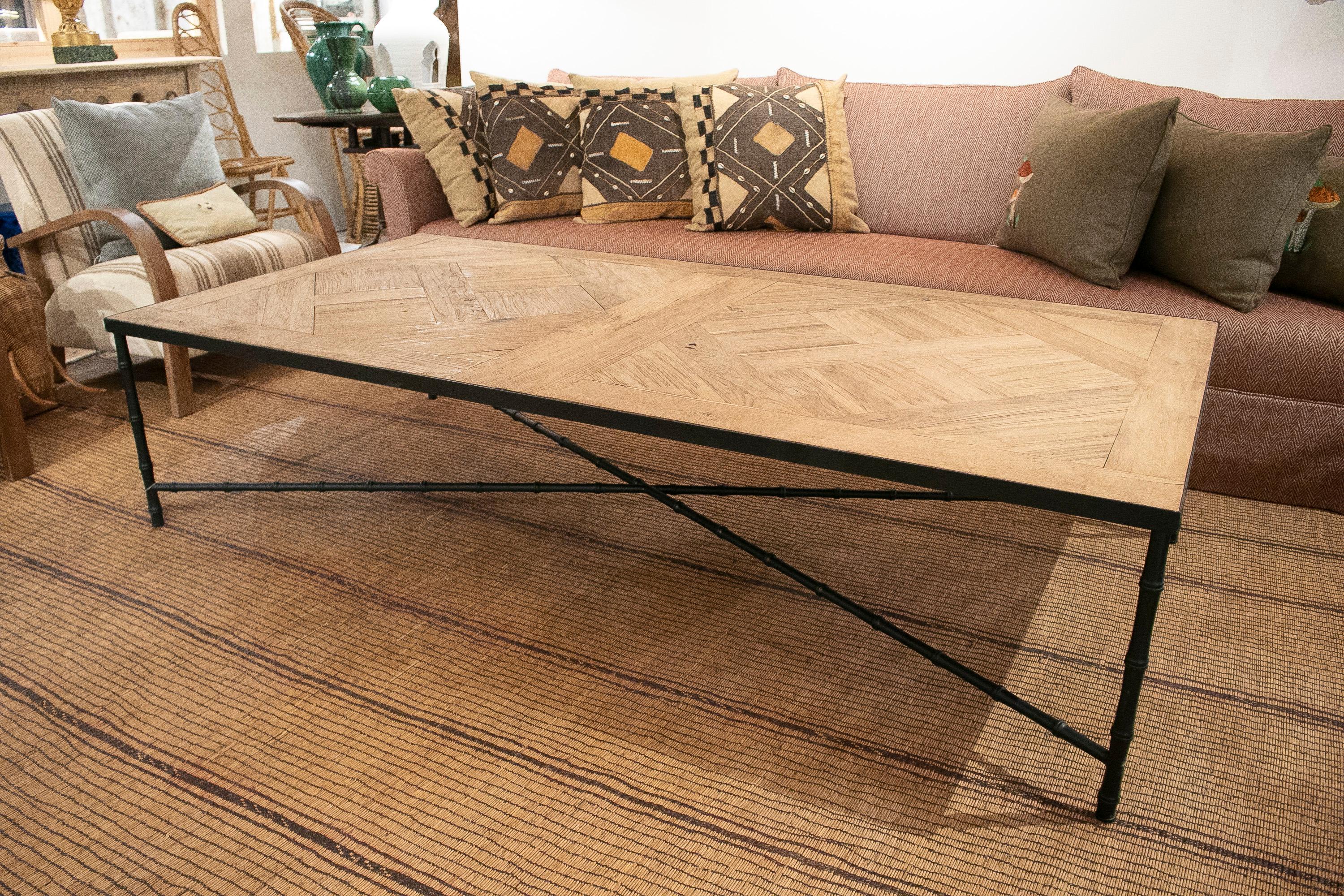 Rustic 1990s French iron coffee table with oak parquet top.