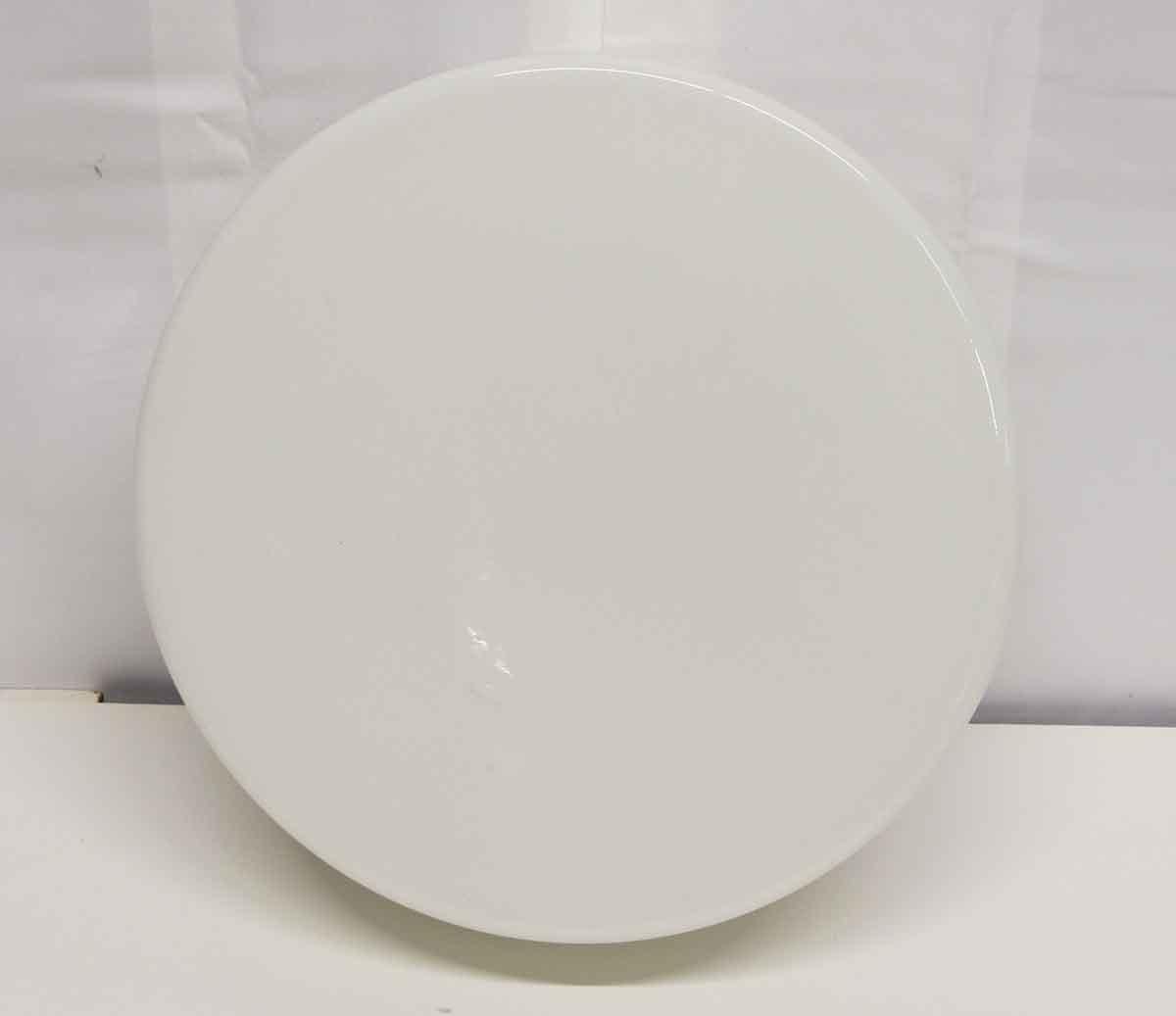 Round white 1990s Mid-Century Modern style French opaline glass flush mount fixture with a white steel base. Small quantity available at time of posting. Please inquire. Priced each. Small quantity available at time of posting. Please inquire.