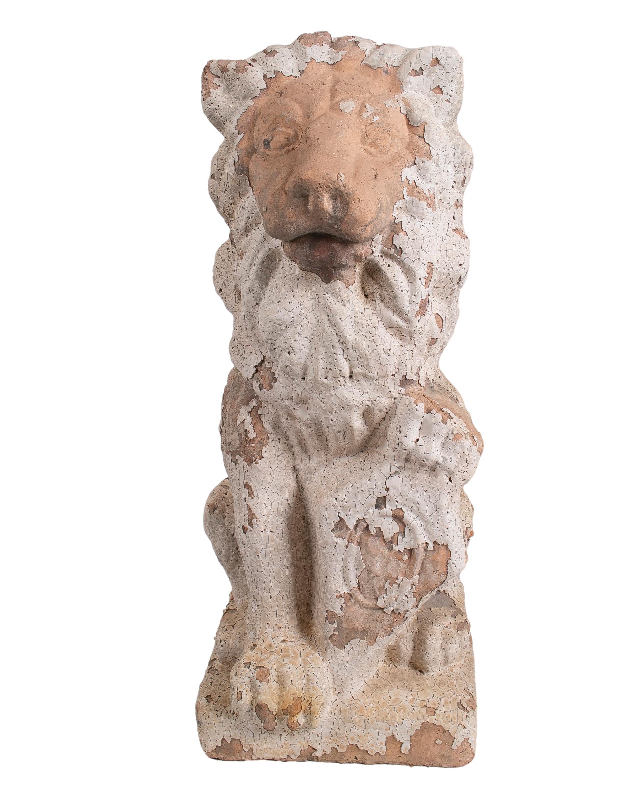 1990s French natural terracotta lion with shield garden sculpture.