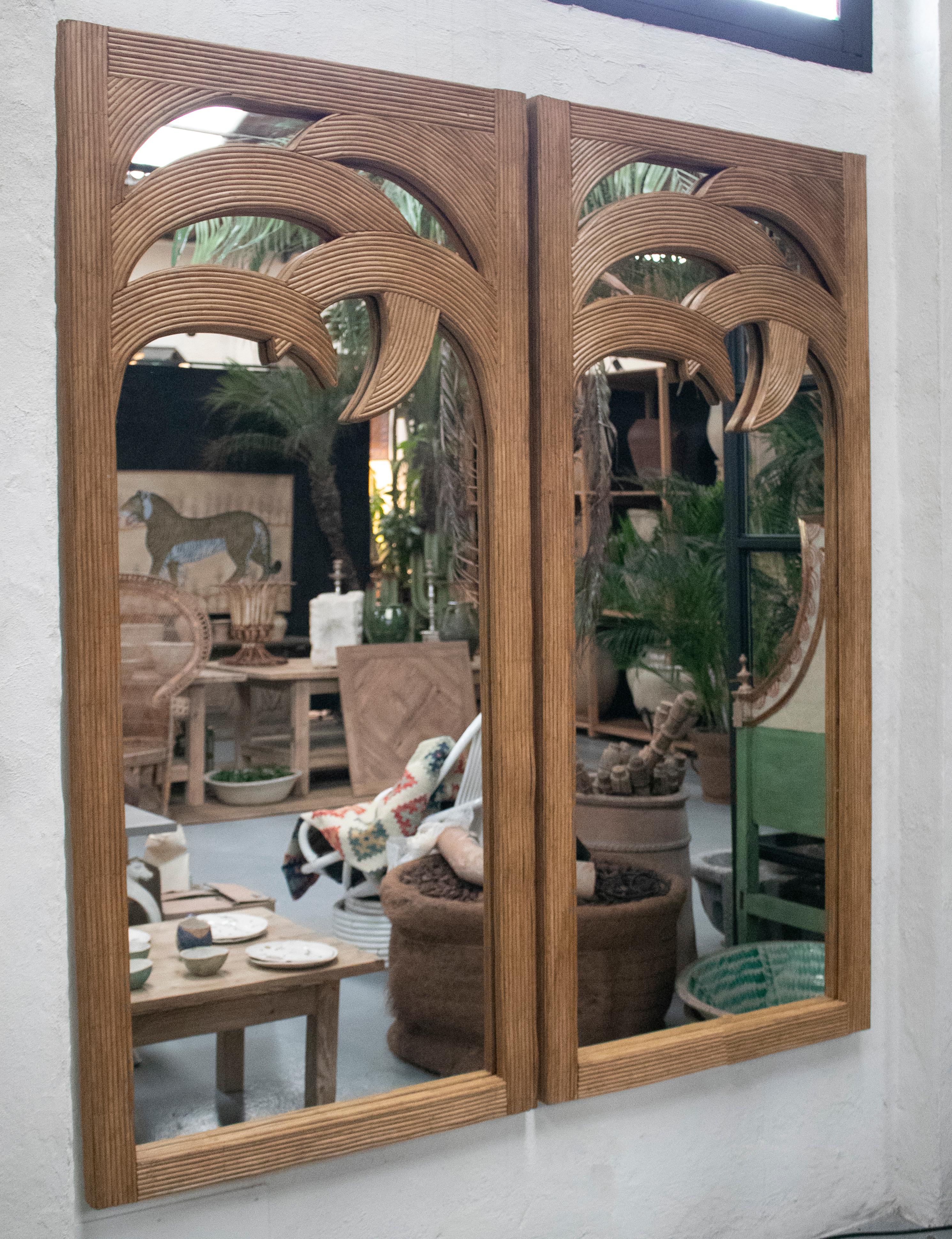 1990s French pair of palm shaped bamboo mirrors.

   