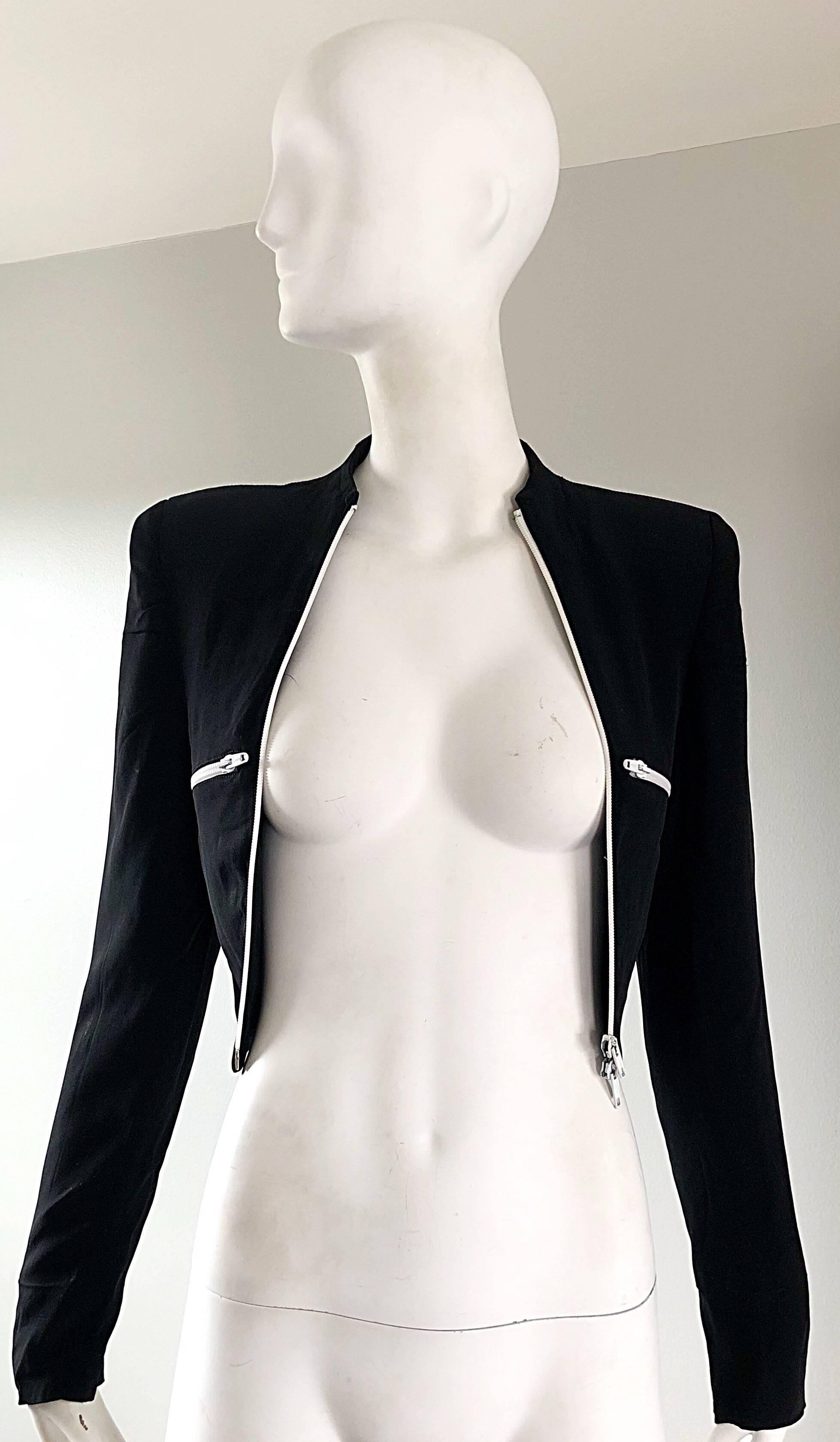The perfect 80s black and white jacket from RIFAT OZBEK! Smart fitted Avant Garde crop jacket that features white zippers at each breast, and down the front. Interior shoulder pads make a strong stylish shoulder. Meant to be worn open. Soft rayon